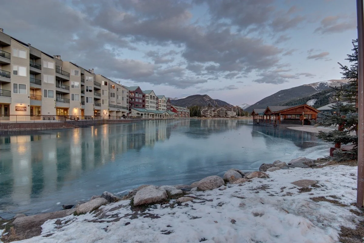 A scenic lakeside winter view where you can book a vacation at Keystone mountain and ski resort. Whether you love skiing, paddleboats, or just being cozy, Crystal Cottage has it all.