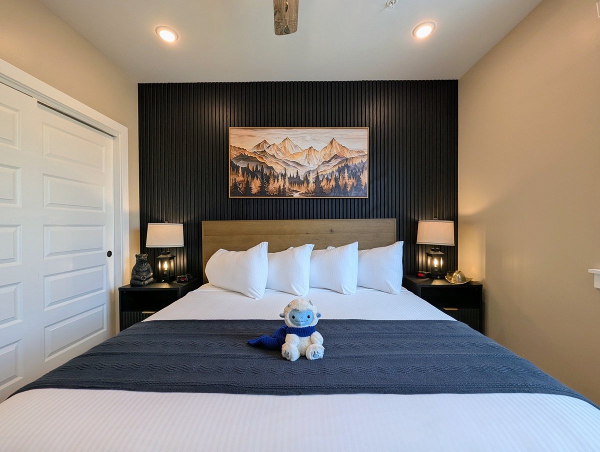 A luxurious bedroom at Crystal Cottage, the perfect place for a lakeside family vacation or a mountain couples getaway.