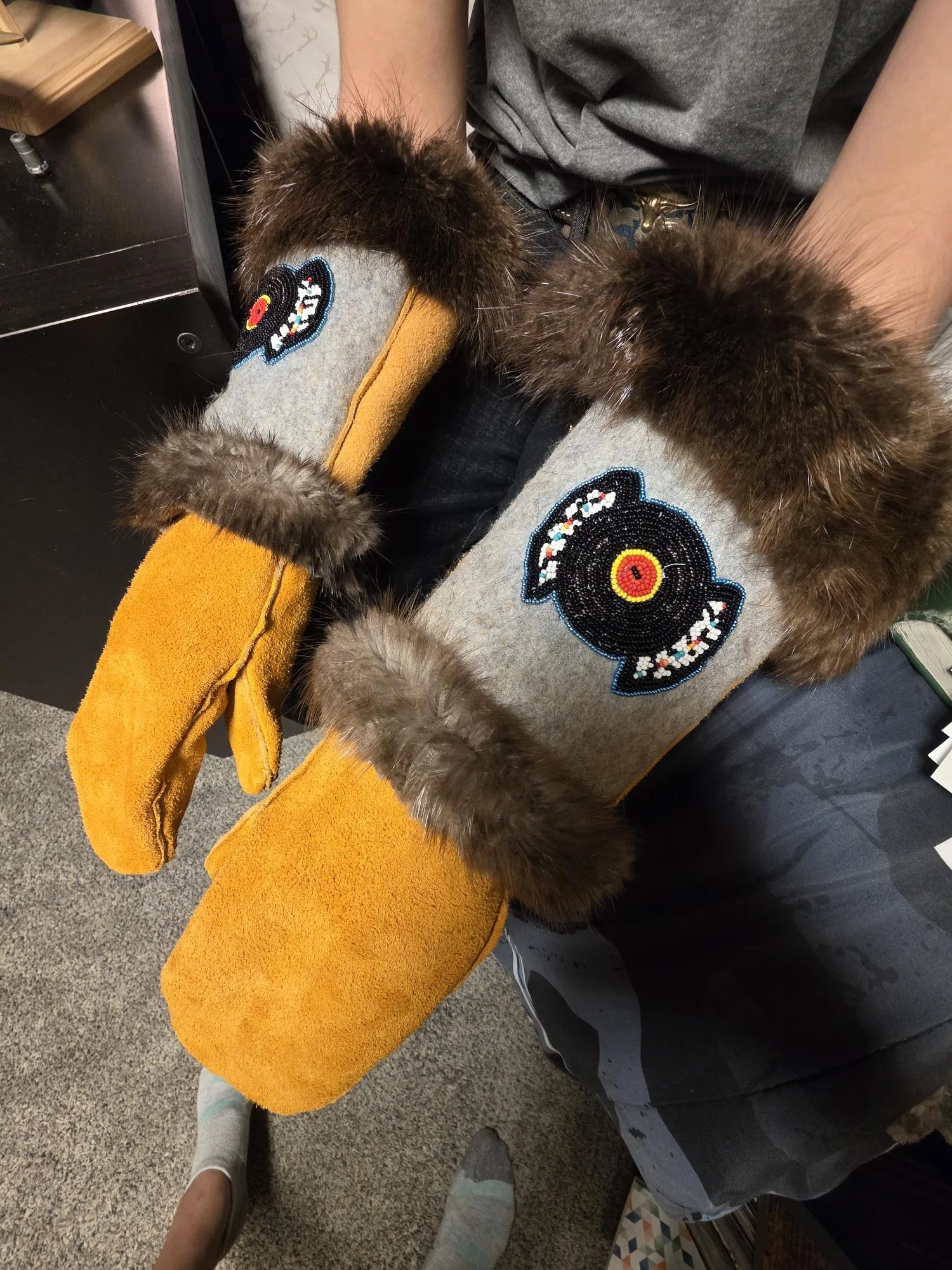 Moose and Elk hide gauntlet mitts with beaver fur trim. Beaded vinyl record and feathers
