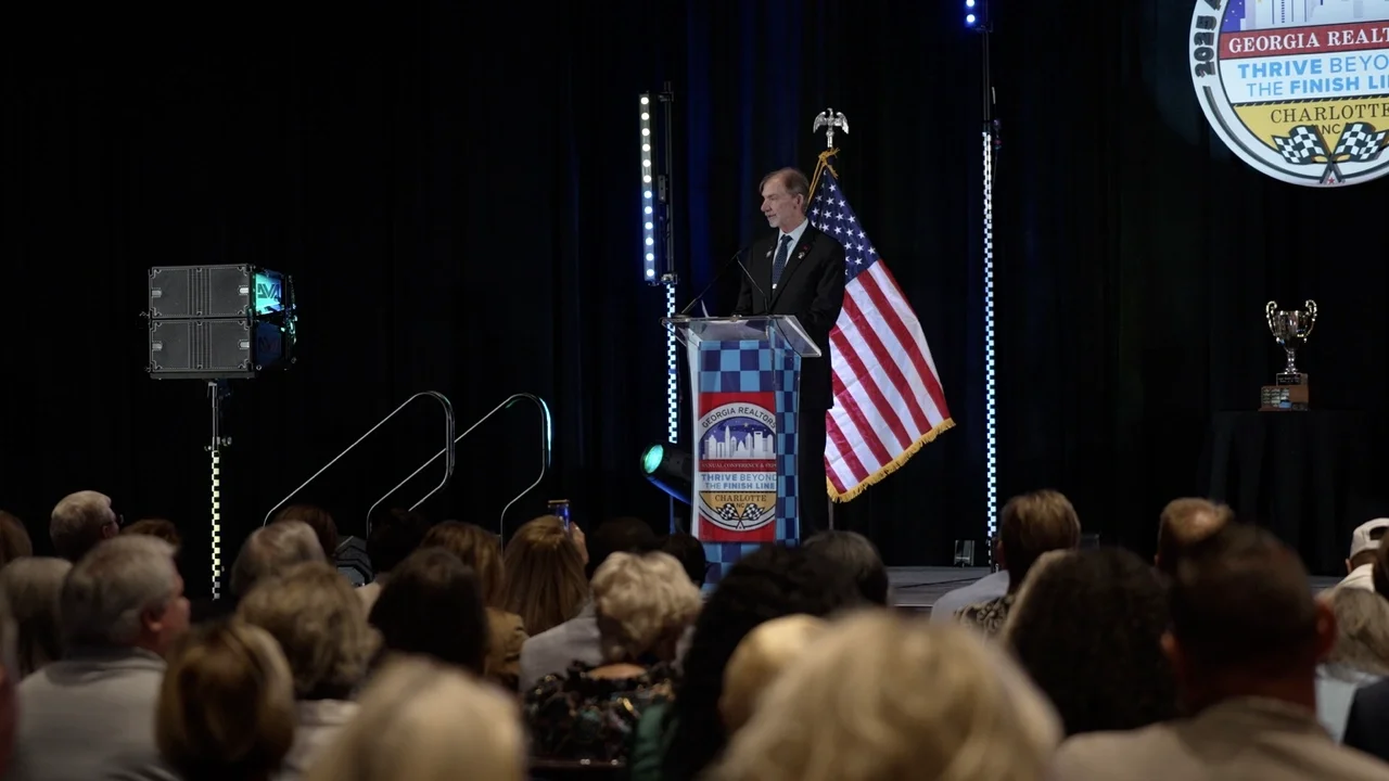 Keynote speaker addressing attendees at the Georgia REALTORS Annual Conference & Expo at the Charlotte Convention Center