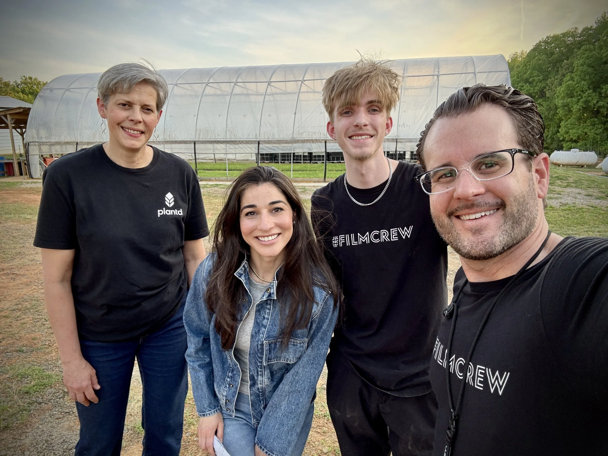 The production crew and Plantd's Director of Agriculture Dr. Janel Ohletz on location at Plantd's grass cultivation facility in Oxford, NC, with HubSpot's The Hustle producer Noelle Medina, filming for an episode on carbon-negative building materials