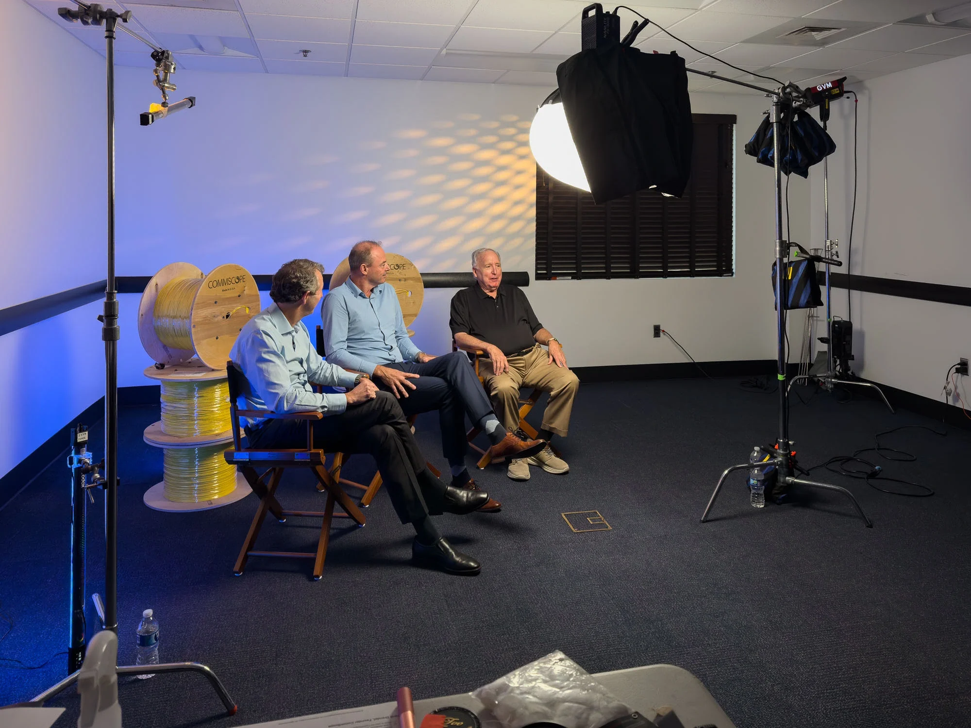 Professional corporate video production setup with multiple cameras during CommScope’s 50th anniversary event.