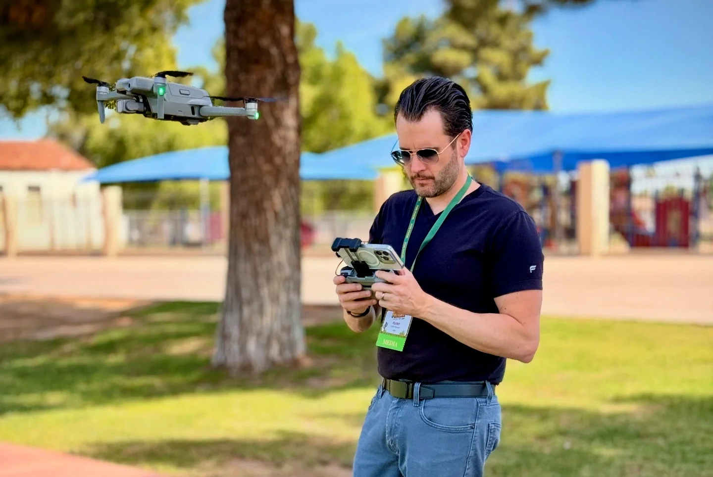Professional drone operator capturing aerial footage for conference and event video production