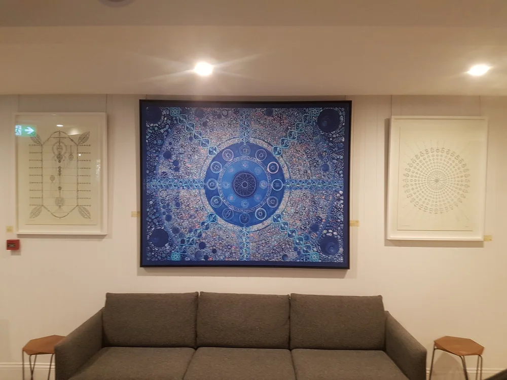 Enigmatic Drawings artwork presented within a professional or commercial interior