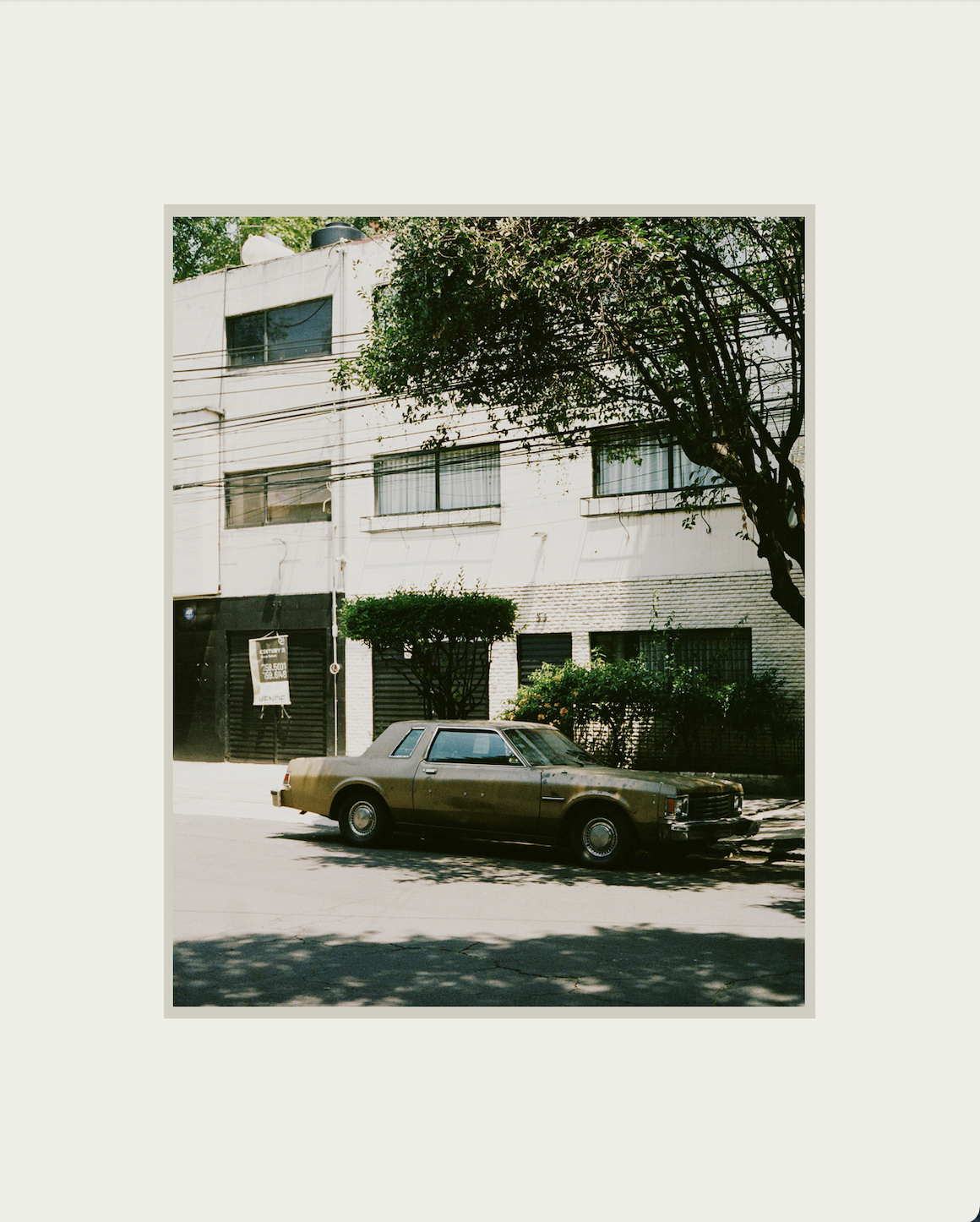 Photo of a vintage mustard color car on the streets of Mexico City