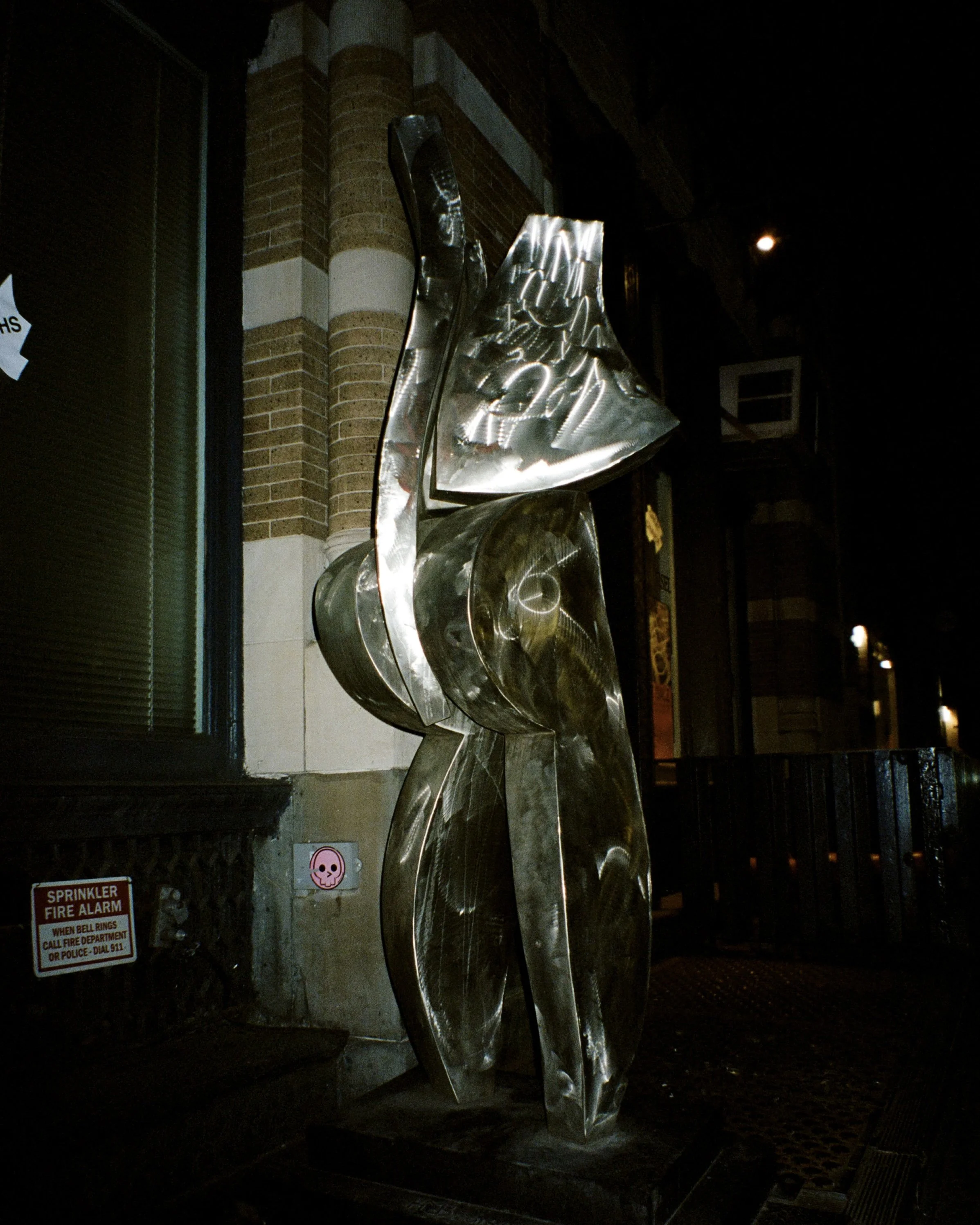 A photo of a metal sculpture on the street in SoHo, New York