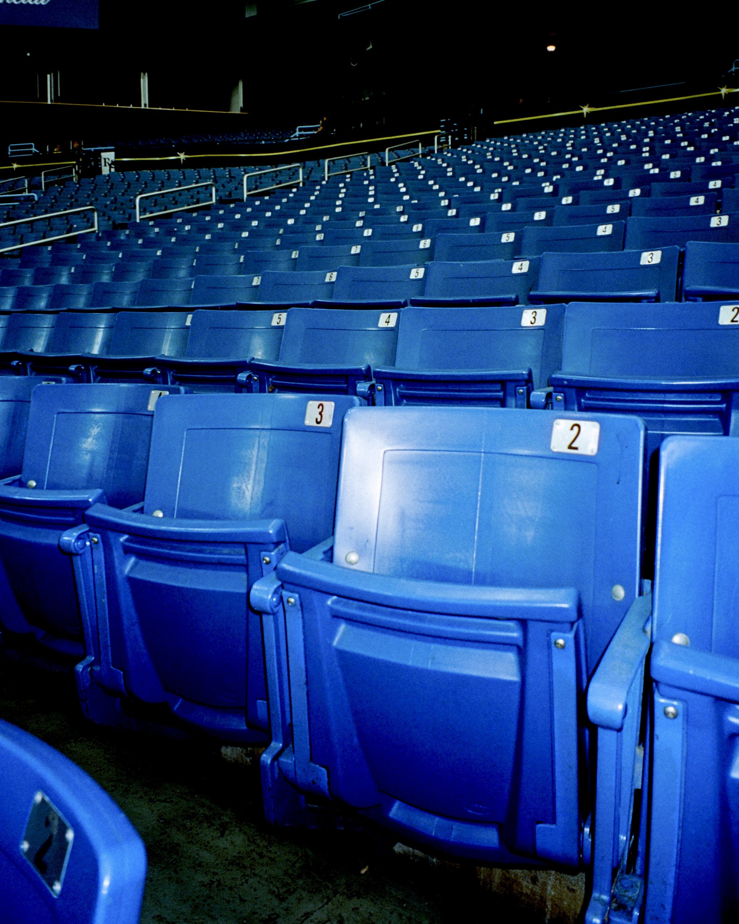 Blue plastic seats in a baseball stadium