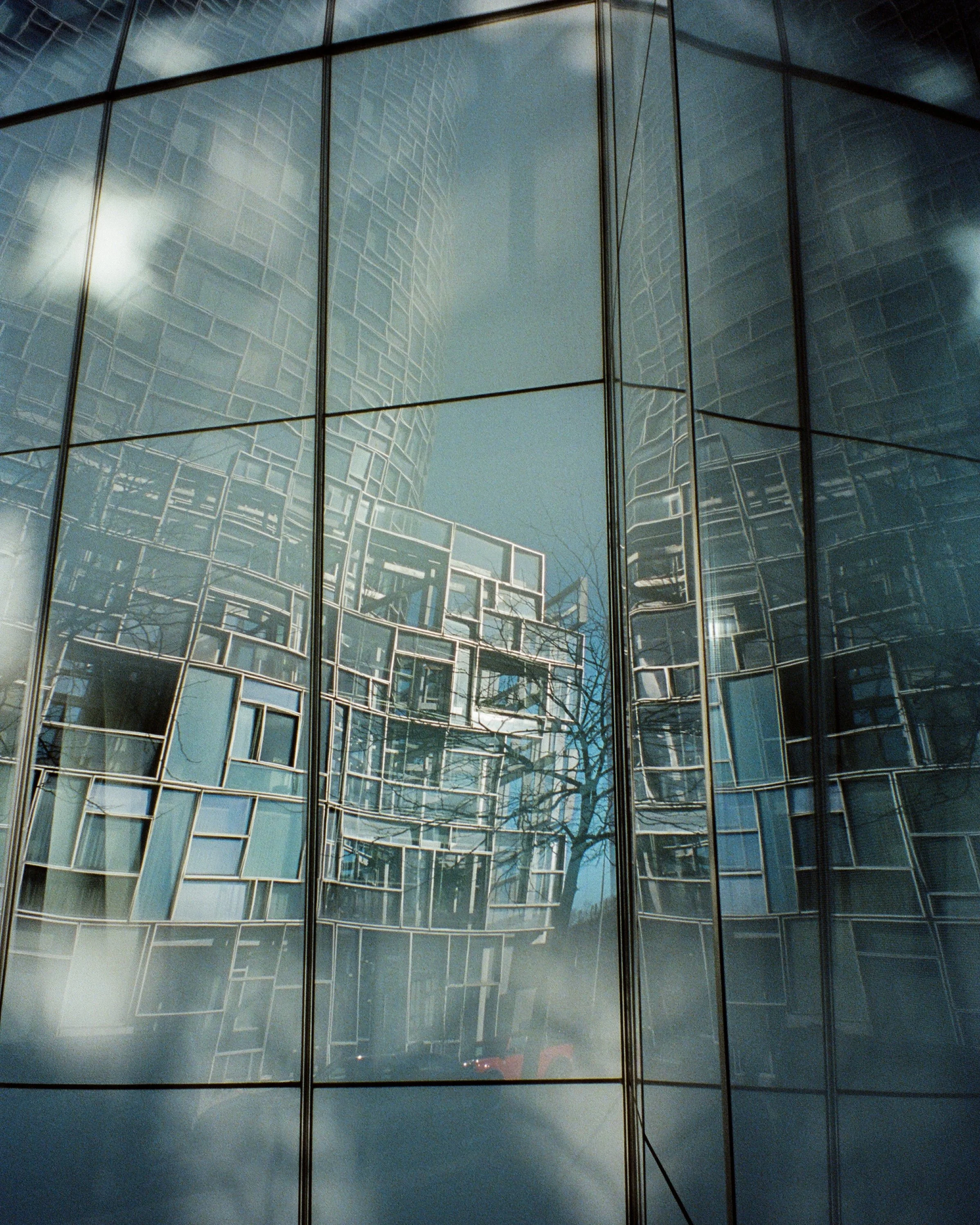A building's reflection in the windows of an opposing building