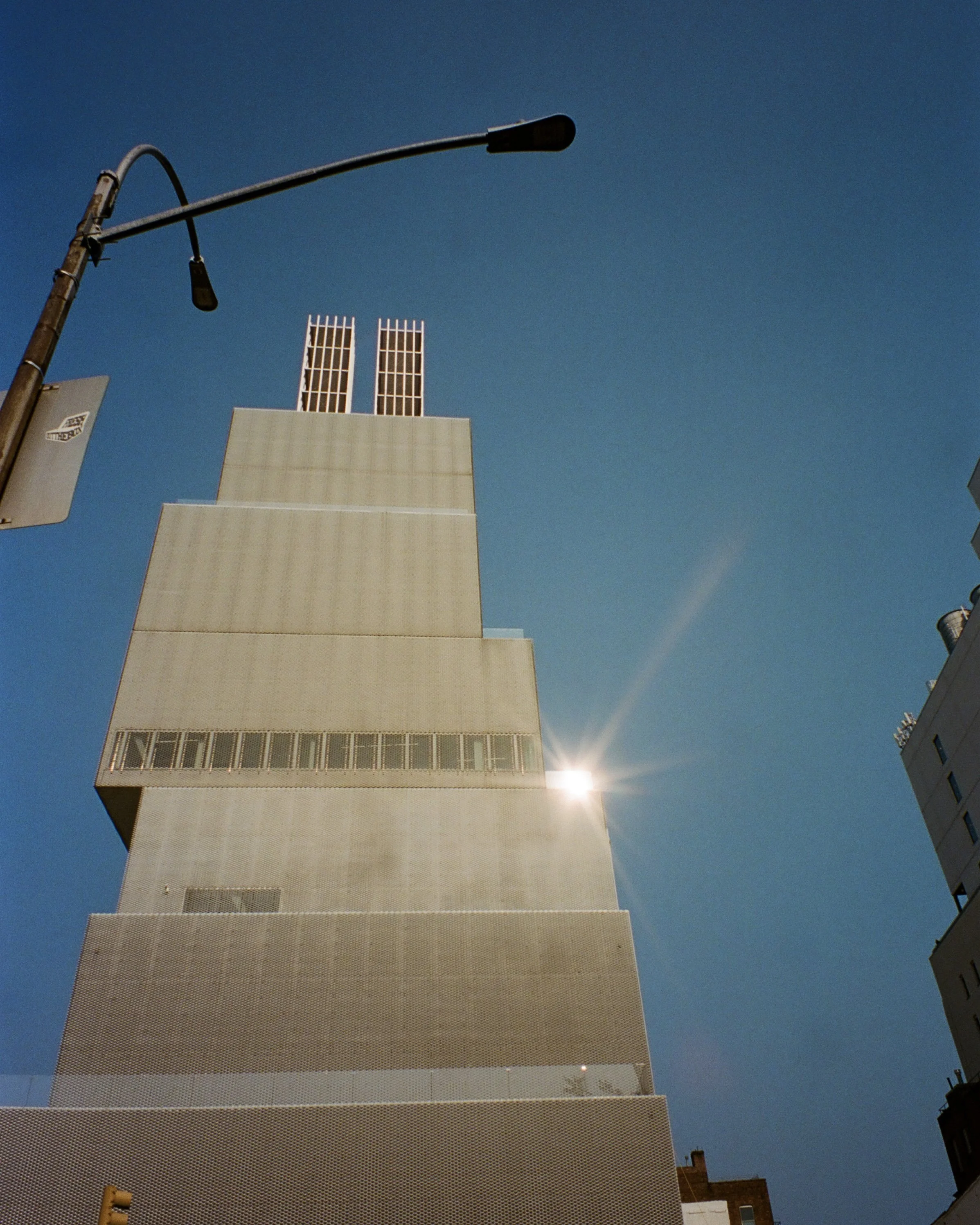 The reflection of the sun on The New Museum