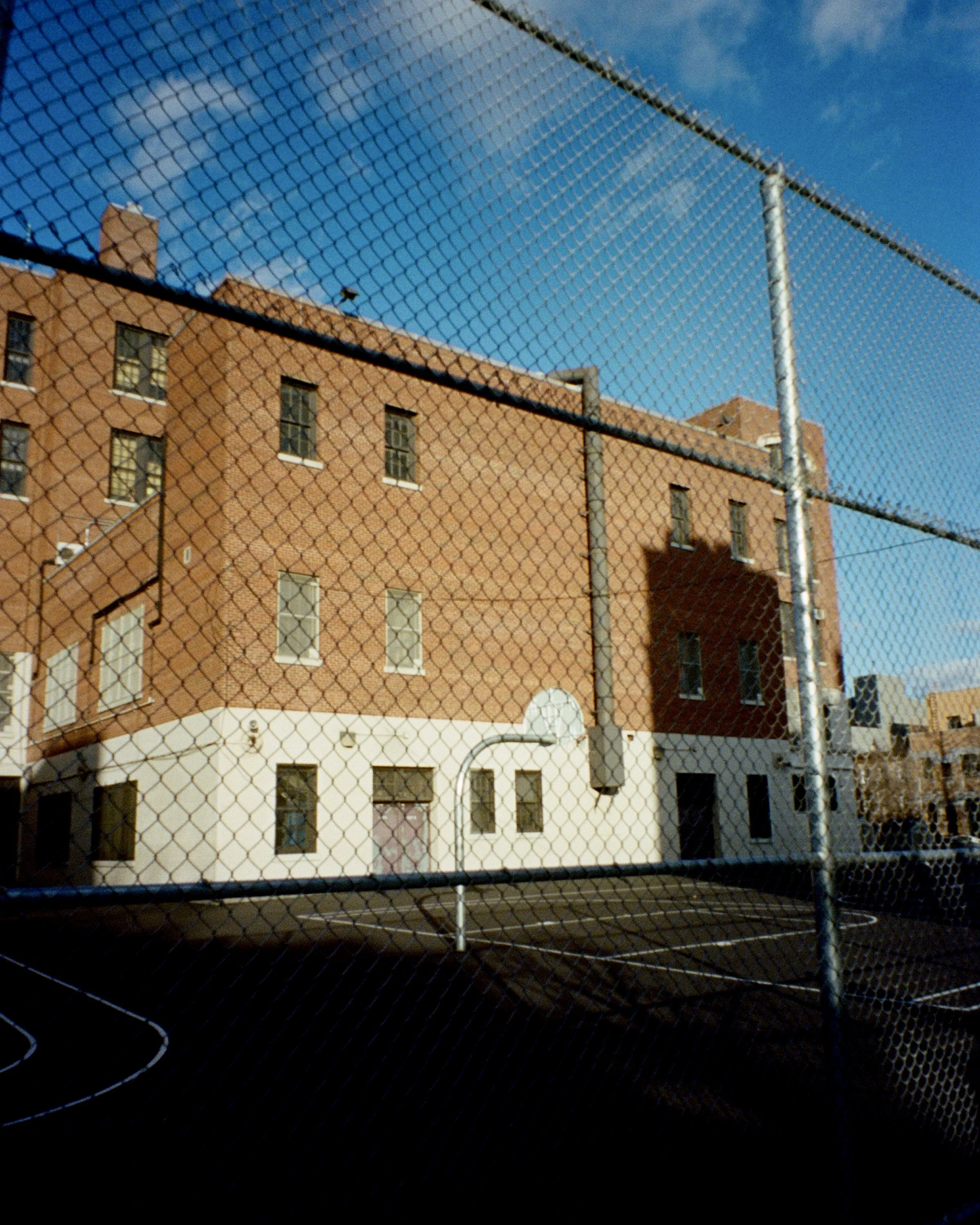A photo of harsh sunlight on a school basketball court