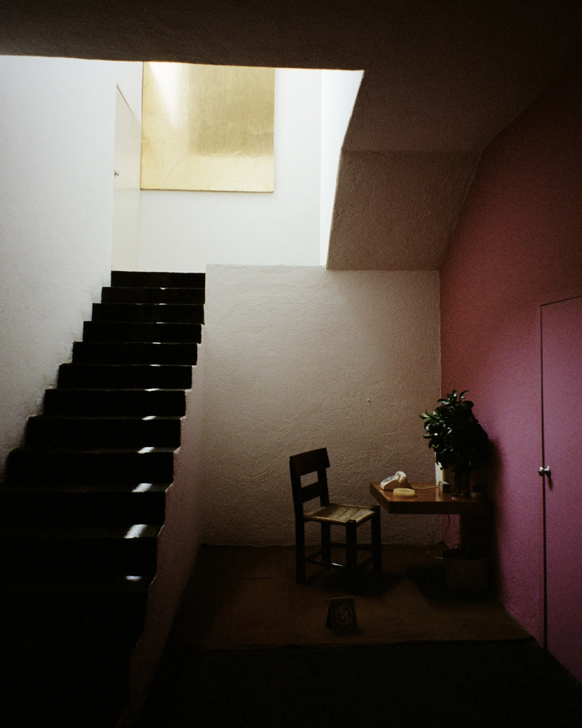 A staircase in the entry room of Casa Barragan