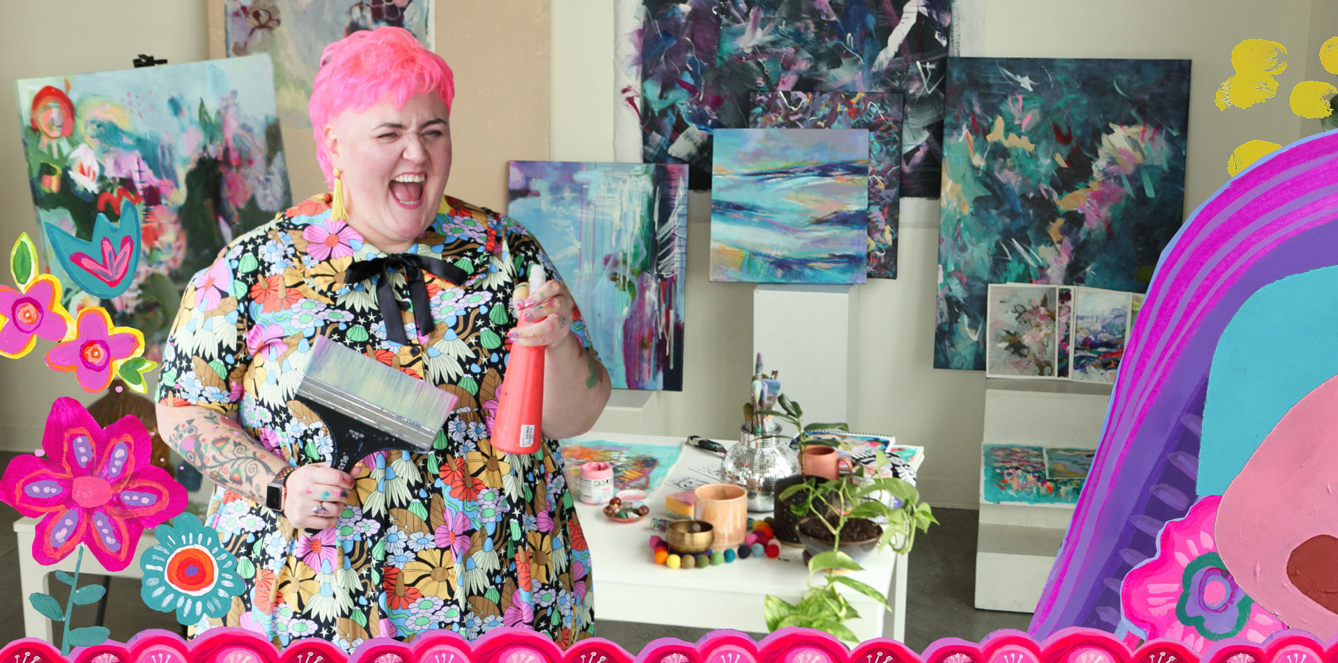A woman with short pink hair, wearing a colorful floral dress, laughing in an art studio filled with abstract paintings and art supplies.