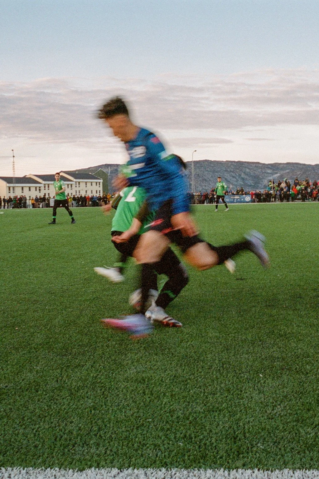 On the world's biggest island, two players from rival teams B67 of Nuuk and N48 of Ilulissat fight for control of the ball during the Greenlandic Football Championship... Greenland's most important sports week of the year.