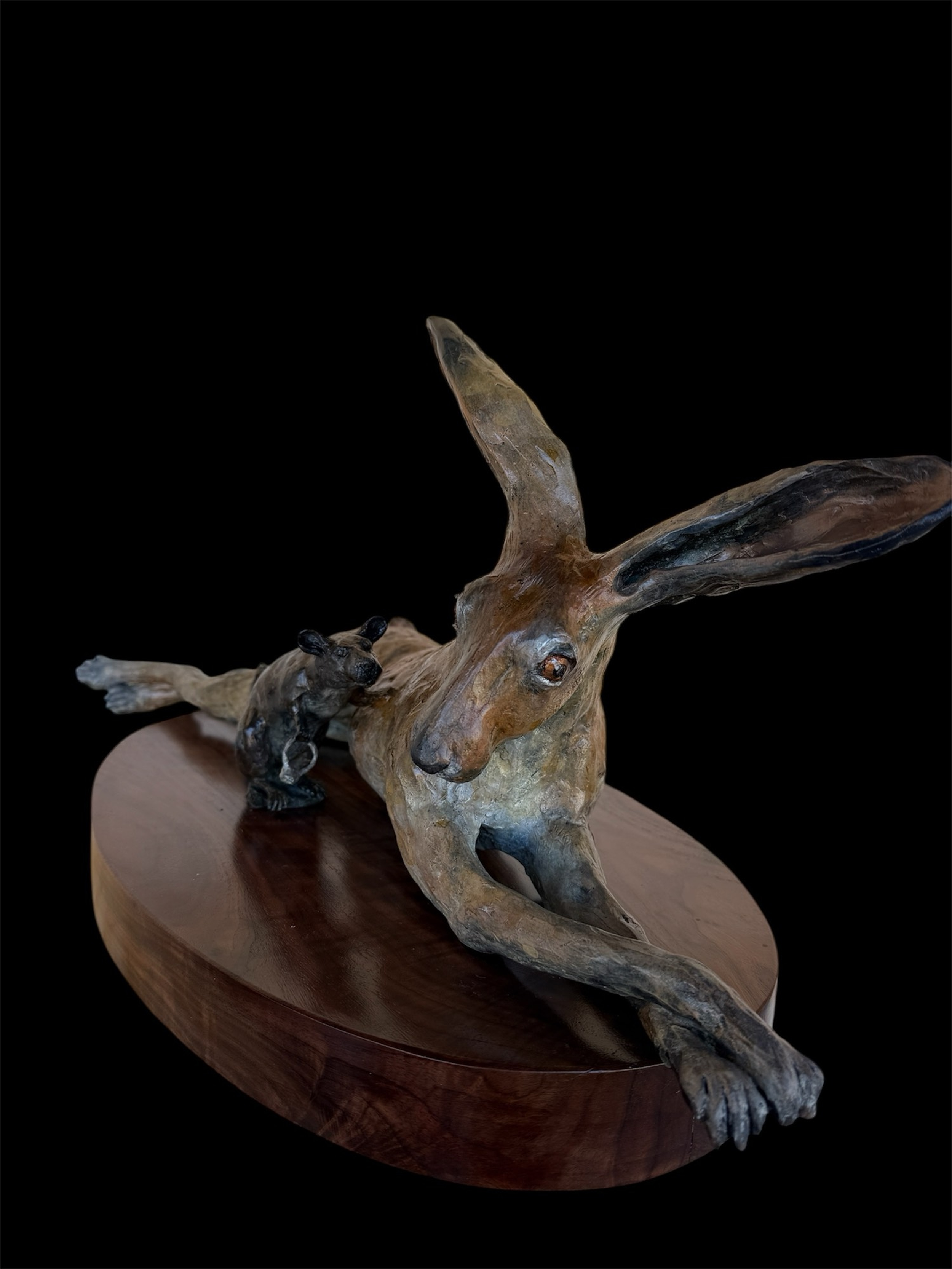 "Unlikely Friends: Shiny Offerings" • Size 26” long 12” wide 11” tall • For the first piece in this series, the rat brought something he knew the rabbit would want — a carrot.  Something enticing, so the friendship may begin. This time is different. 