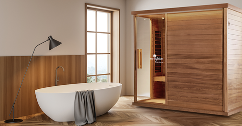 Modern bathroom with a freestanding bathtub, a floor lamp, a window with natural light, and a wooden sauna.