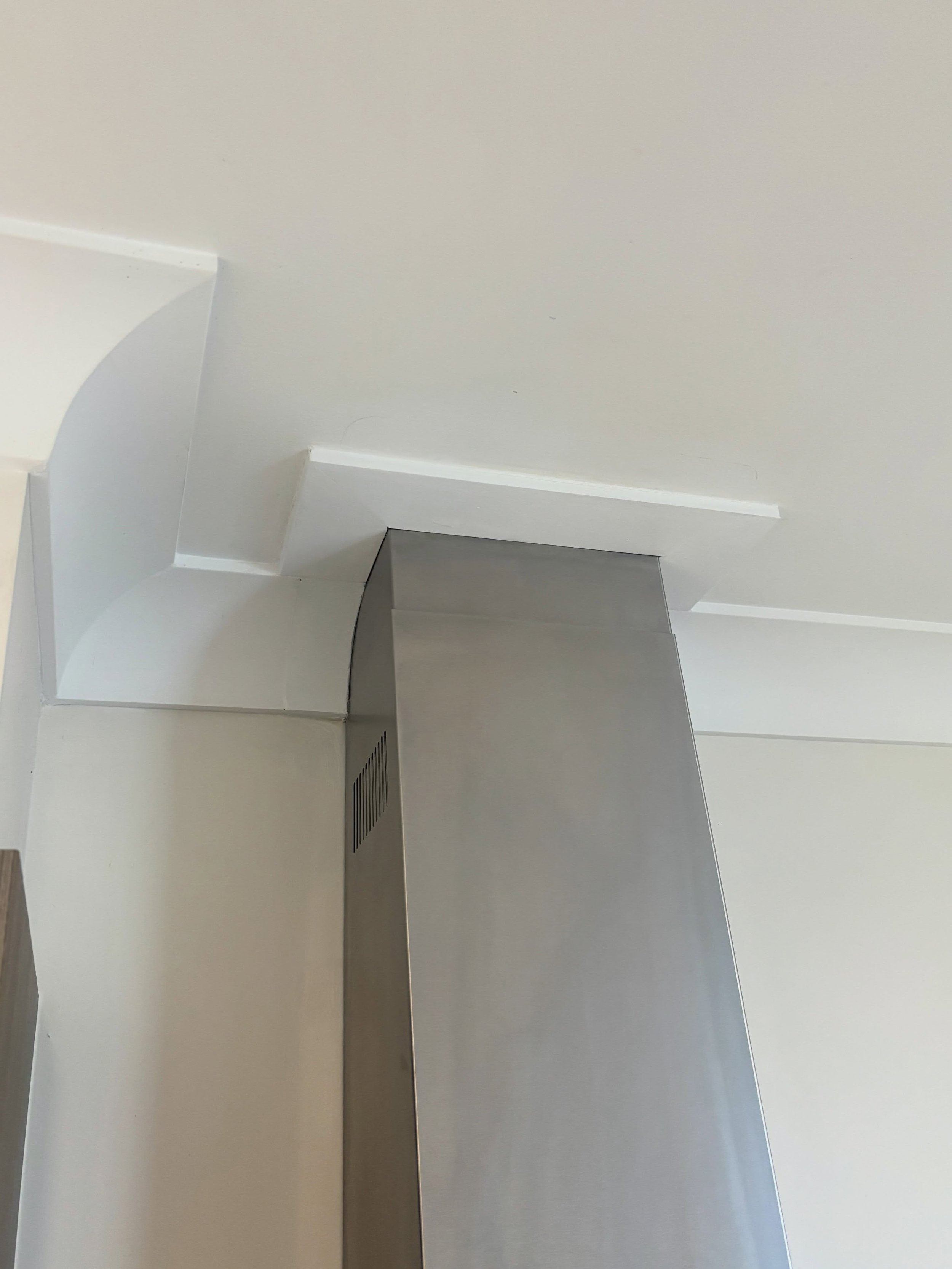 Cornice repair and trim fitted around this flue today, a newly fitted range hood had left quite a gap from previous hood. So this is what we come up with.