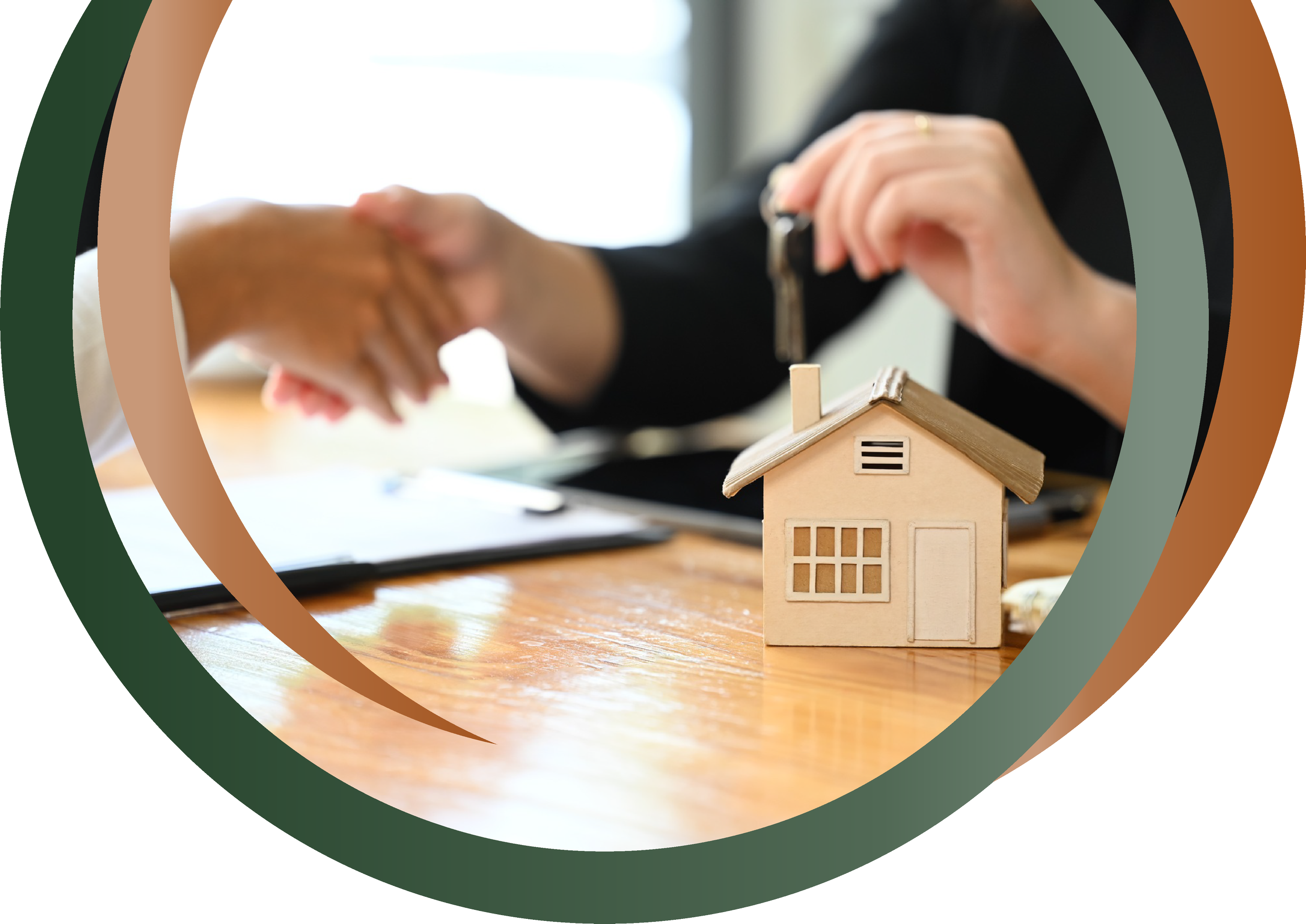 A person hands over the keys to a woman in front of a small wooden house model, symbolizing a real estate transaction.