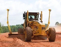 Motor grader on construction site - GPS machine control models for Trimble, Topcon, and Leica