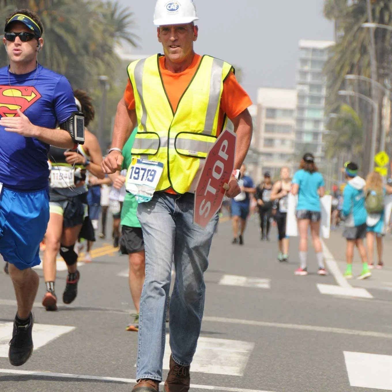 Allen Anderson running a marathon in construction gear during a Guinness World Record attempt