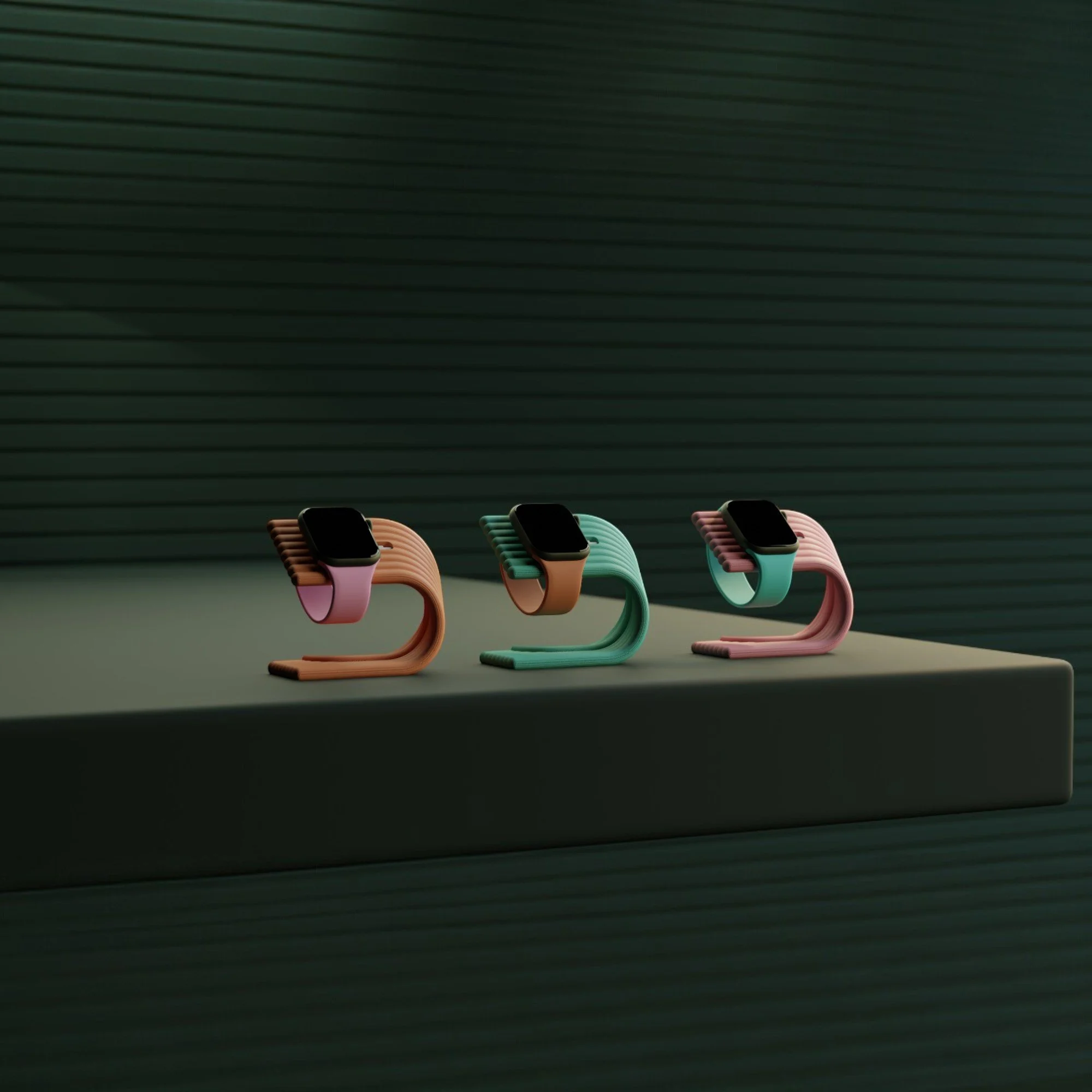 Apple Watch Ladeständer in drei Farben auf dunkler Ablage, reduzierte Formgebung als stilvolles Zubehör für Nachttisch oder Arbeitsplatz.