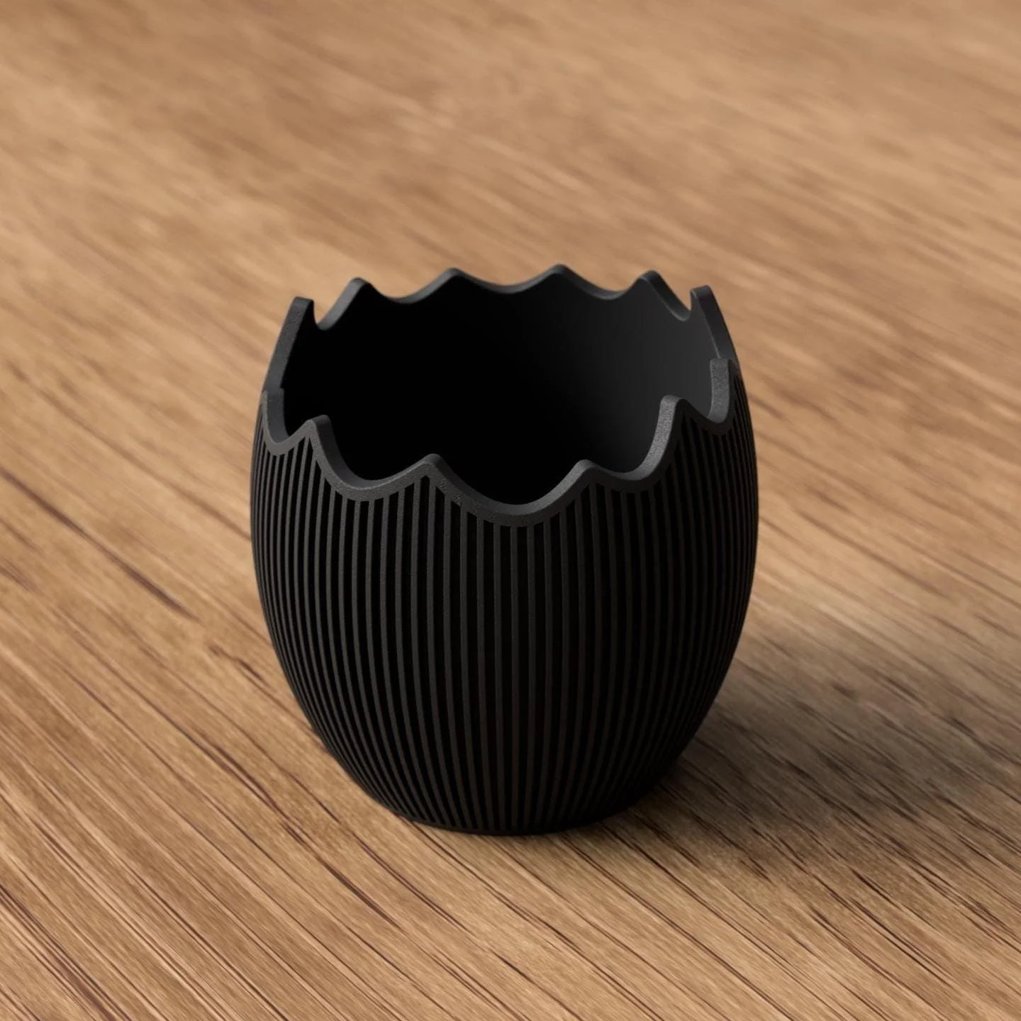 Schwarze Osterschale mit Hasenohren im Eierschalen-Design, modern und kontraststark als dekoratives Detail für Ostern.