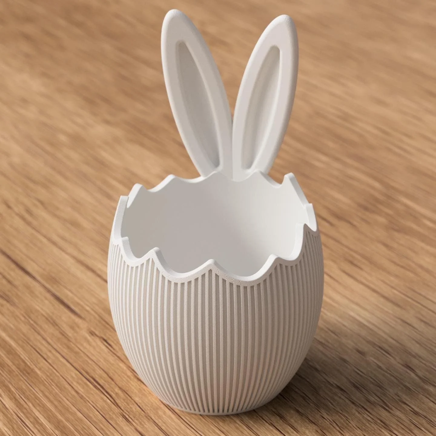 Weiße Osterschale mit Hasenohren und gezacktem Eierschalenrand, klar und modern gestaltet als dekorativer Osterakzent.