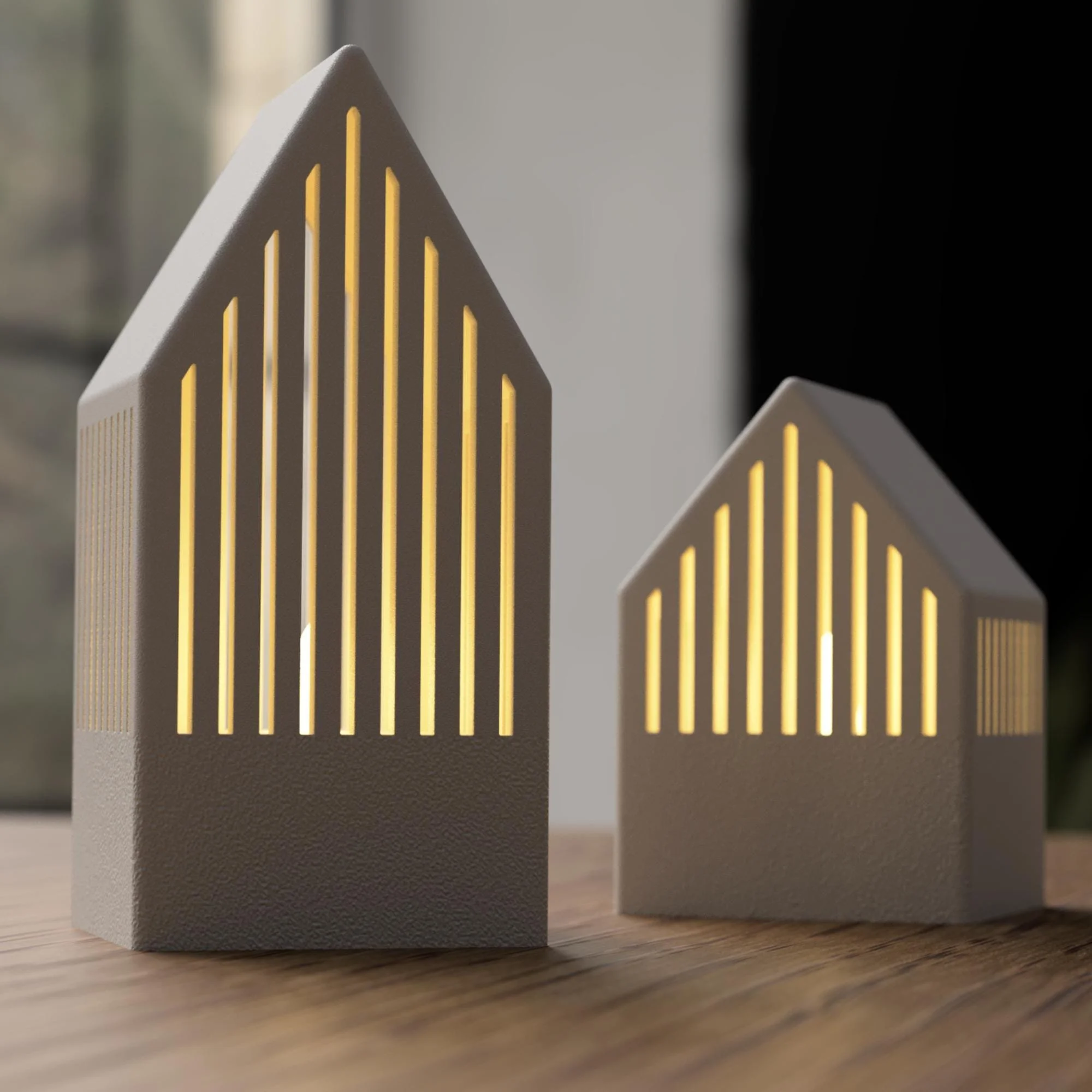 Japandi Teelichthaus Set in hellen Naturtönen mit großem und kleinem Haus, beleuchtet nebeneinander auf Holzoberfläche arrangiert.