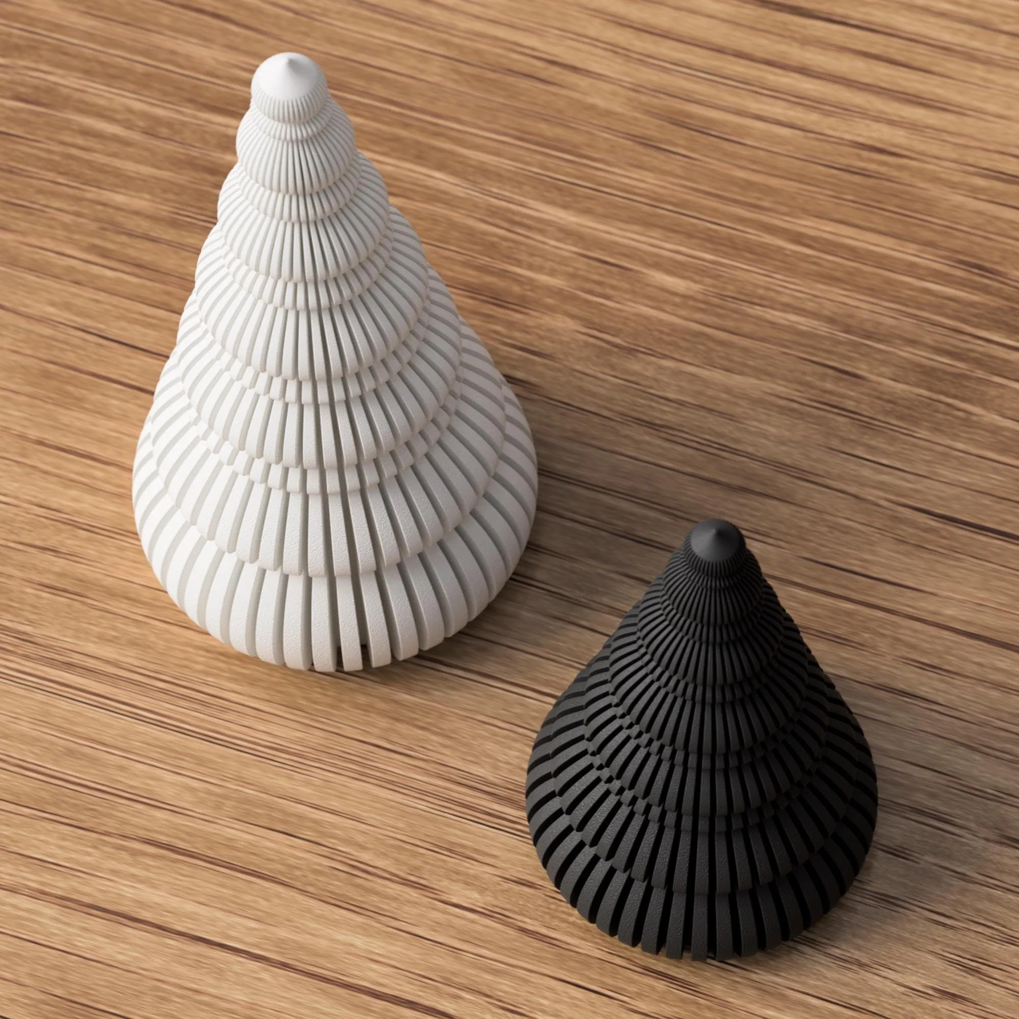 Zwei kleine Deko-Weihnachtsbäume in Weiß und Schwarz auf Holzoberfläche, schräg von oben gezeigt als kontrastreiches Dekoduo.