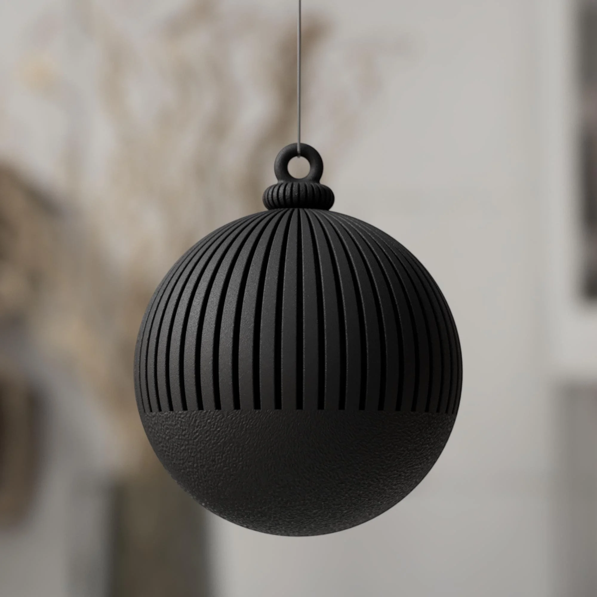 Schwarze Weihnachtskugel im Japandi Stil mit matter Oberfläche und gleichmäßiger Rillenoptik für eine schlichte, moderne Winterdeko.