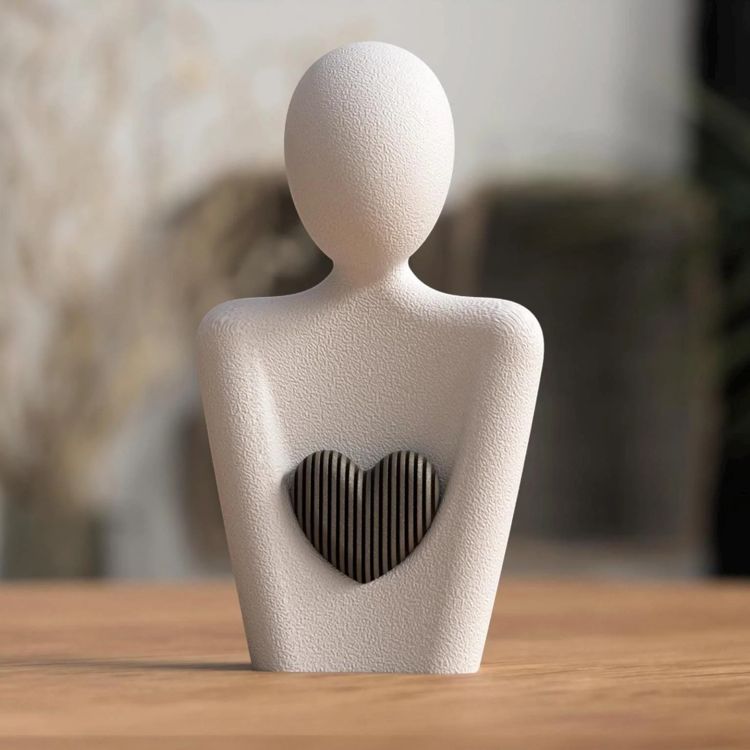Minimalistische Herzfigur in Weiß mit dunklem Holzeinsatz auf einer Holzfläche, stilvolle Dekofigur für Regal, Sideboard oder Schreibtisch.