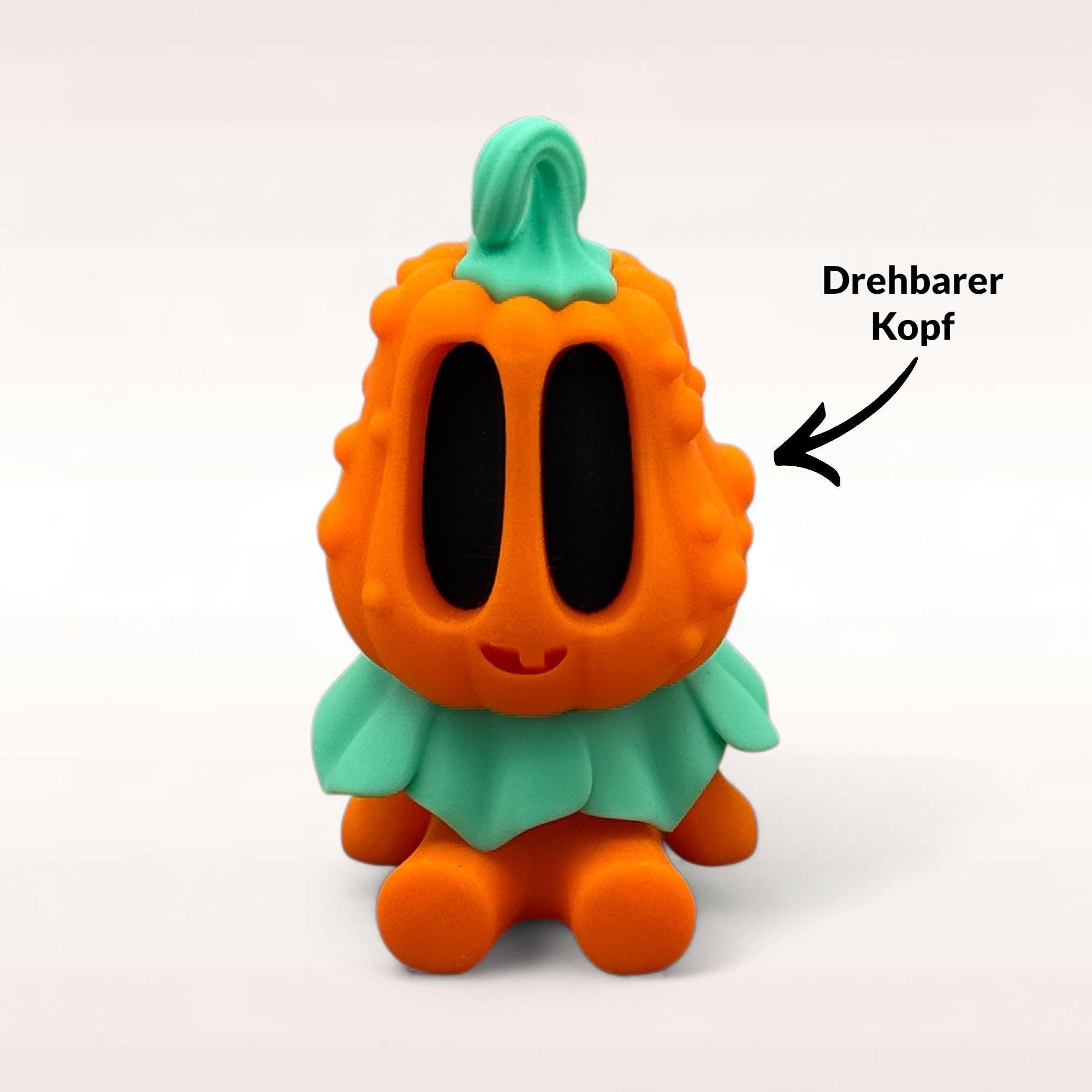 Variante Bumpy mit hervorgehobenem drehbarem Kopf, schwarzem Gesicht und grünem Blätterkragen auf hellem Hintergrund.