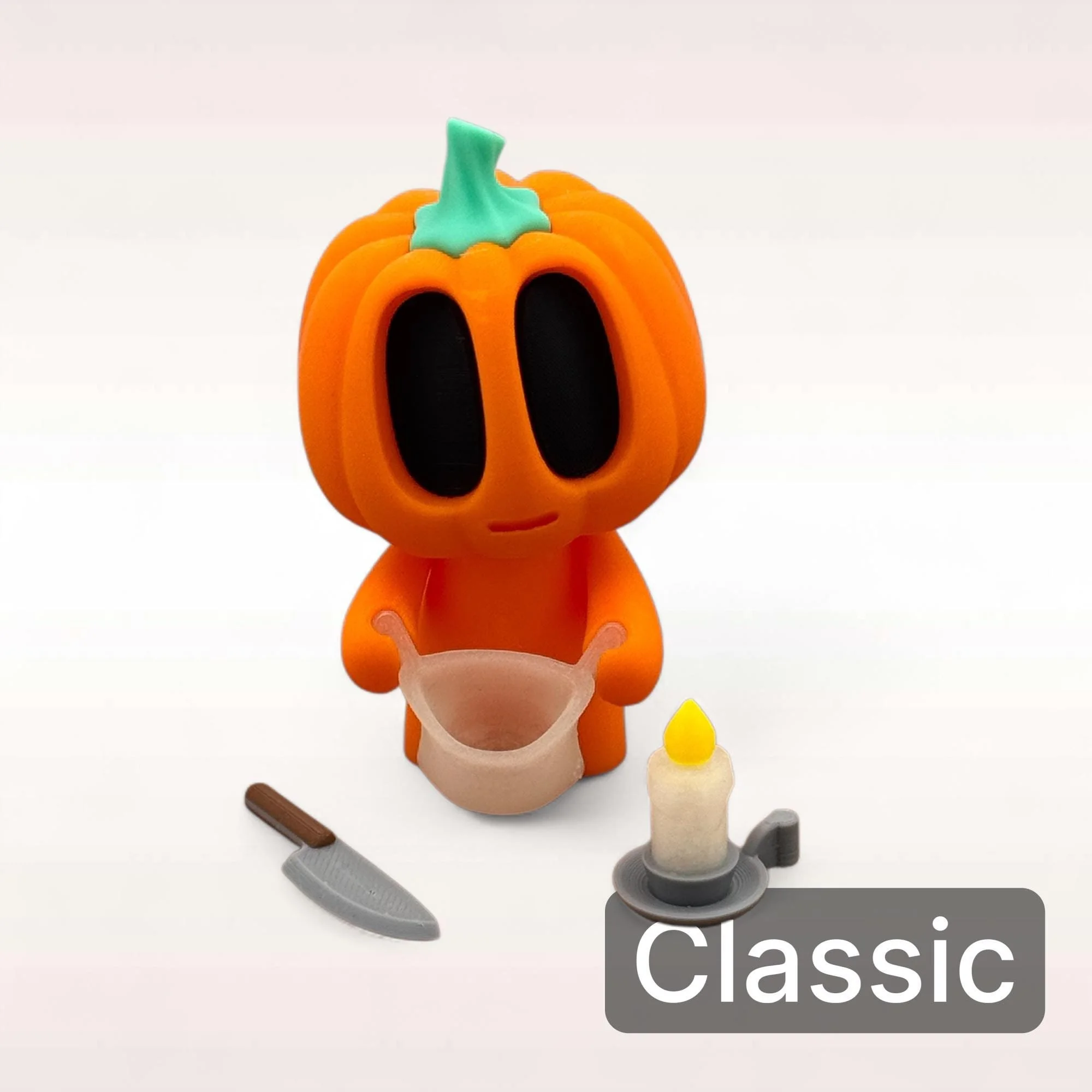 Mini Kürbis Figur Classic in Orange mit schlichtem Körper und kleinem Zubehör als dekorativer Akzent für Halloween und Herbst.