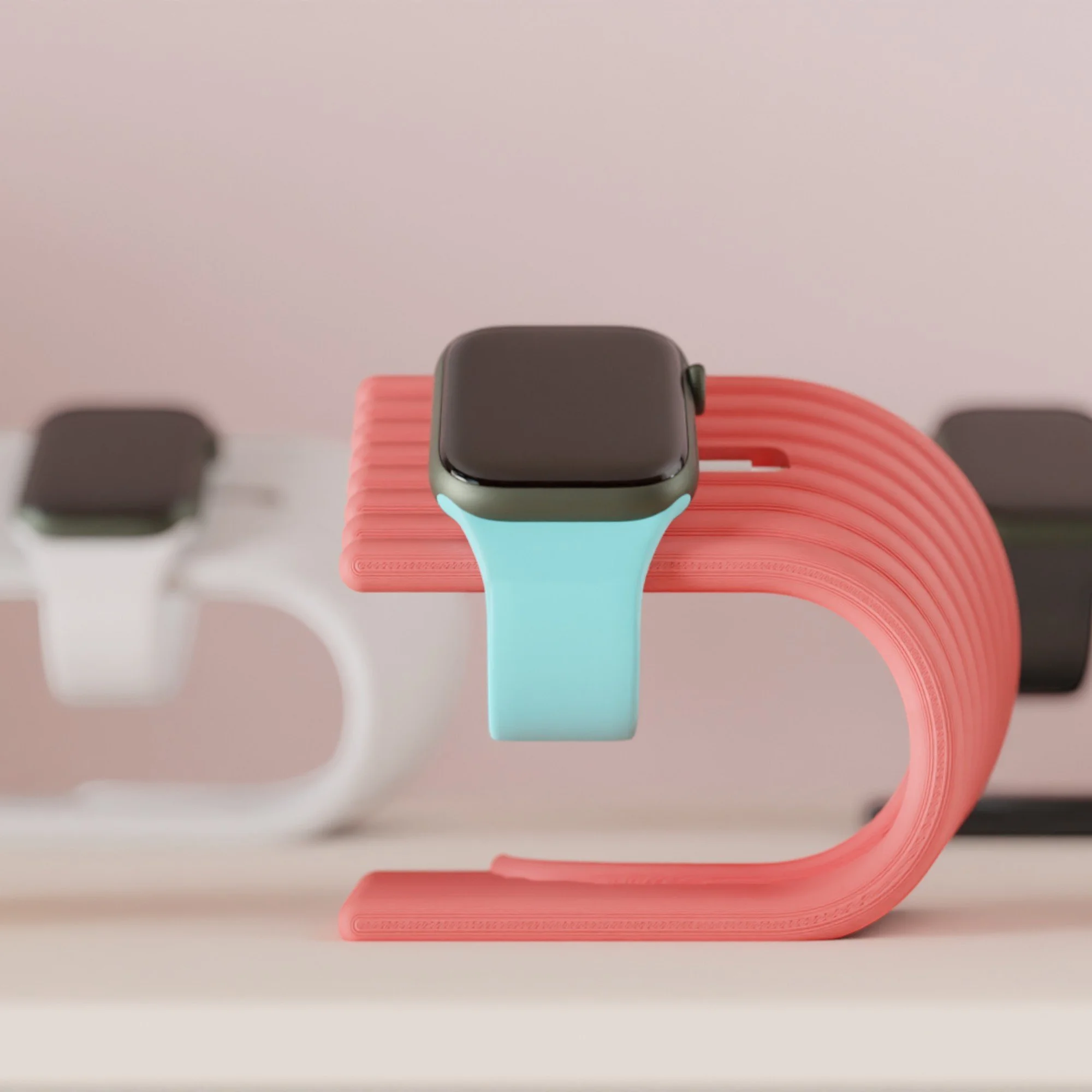 Apple Watch Ladeständer in Koralle und Mint mit eingesetzter Uhr, geschwungene Form für einen sauberen und dekorativen Ladeplatz.