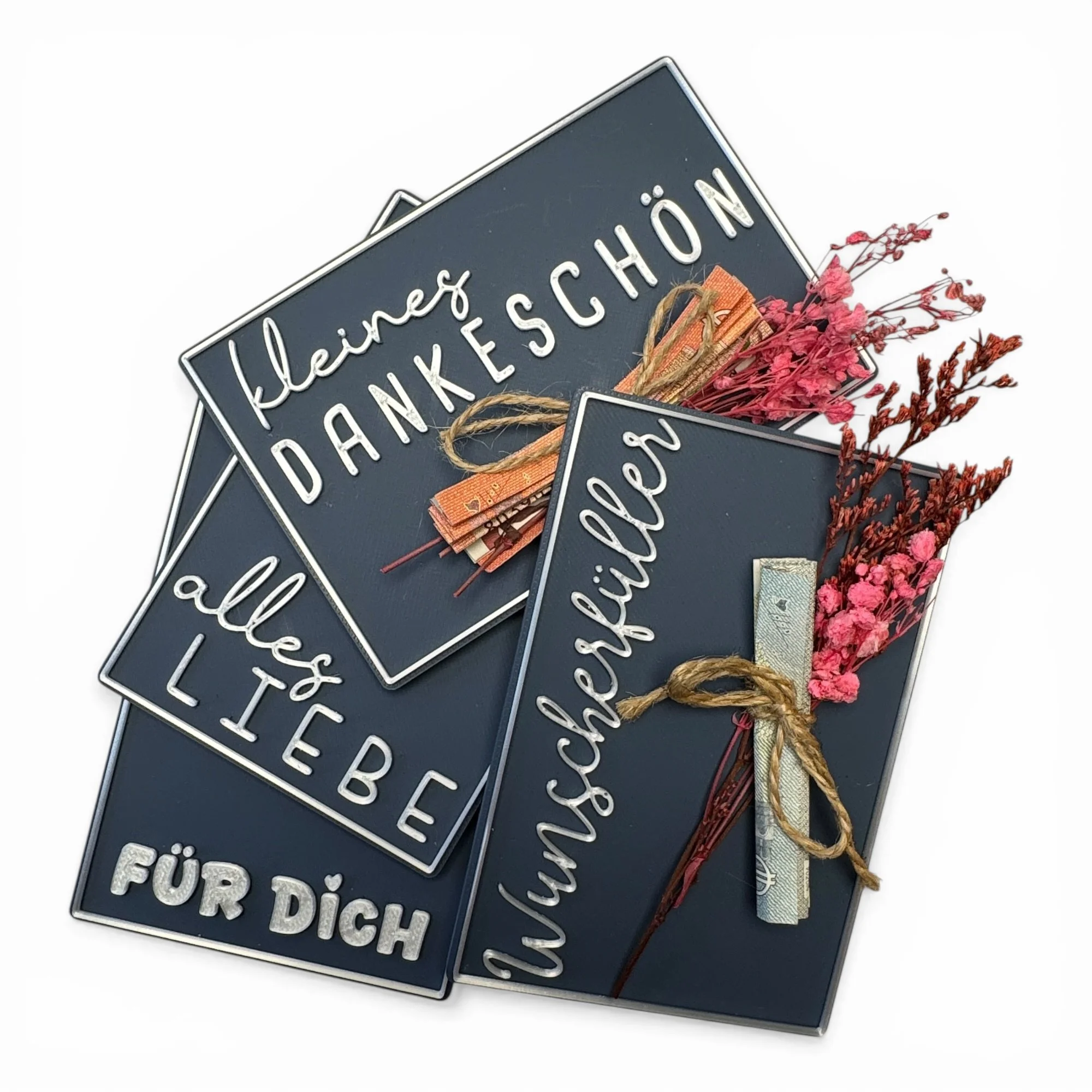 Übersicht mehrerer Spruchvarianten der Geldgeschenk Karte in Dunkelblau mit floraler Dekoration und gerollten Scheinen