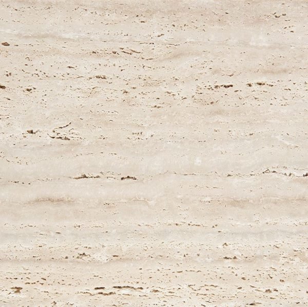 Close-up of a beige, textured stone or tiled surface.
