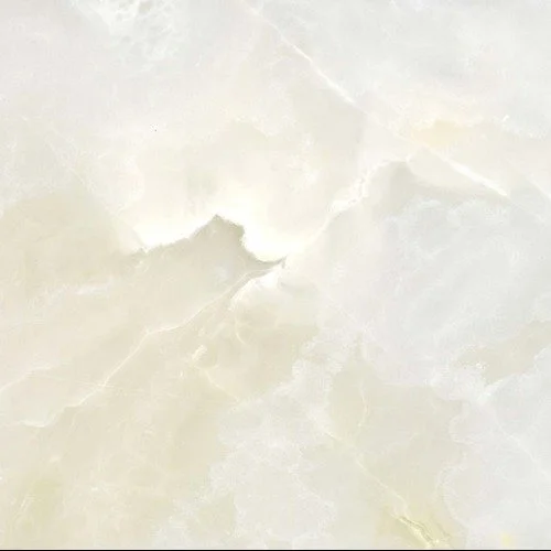 Close-up of a light cream-colored marble surface with subtle veining.