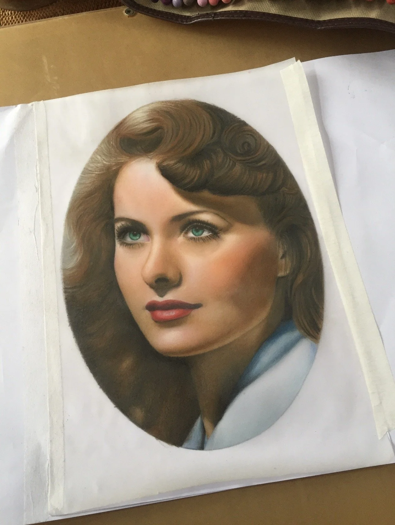 Painted portrait artwork by James Dean featuring a woman with dark hair, red lipstick and a vintage-style mask.