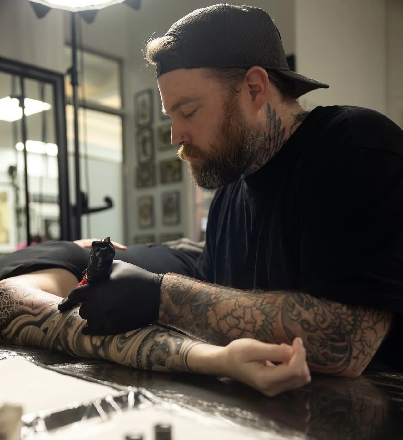 James Dean multidisciplinary artist and tattooer working on a custom tattoo in Auckland New Zealand