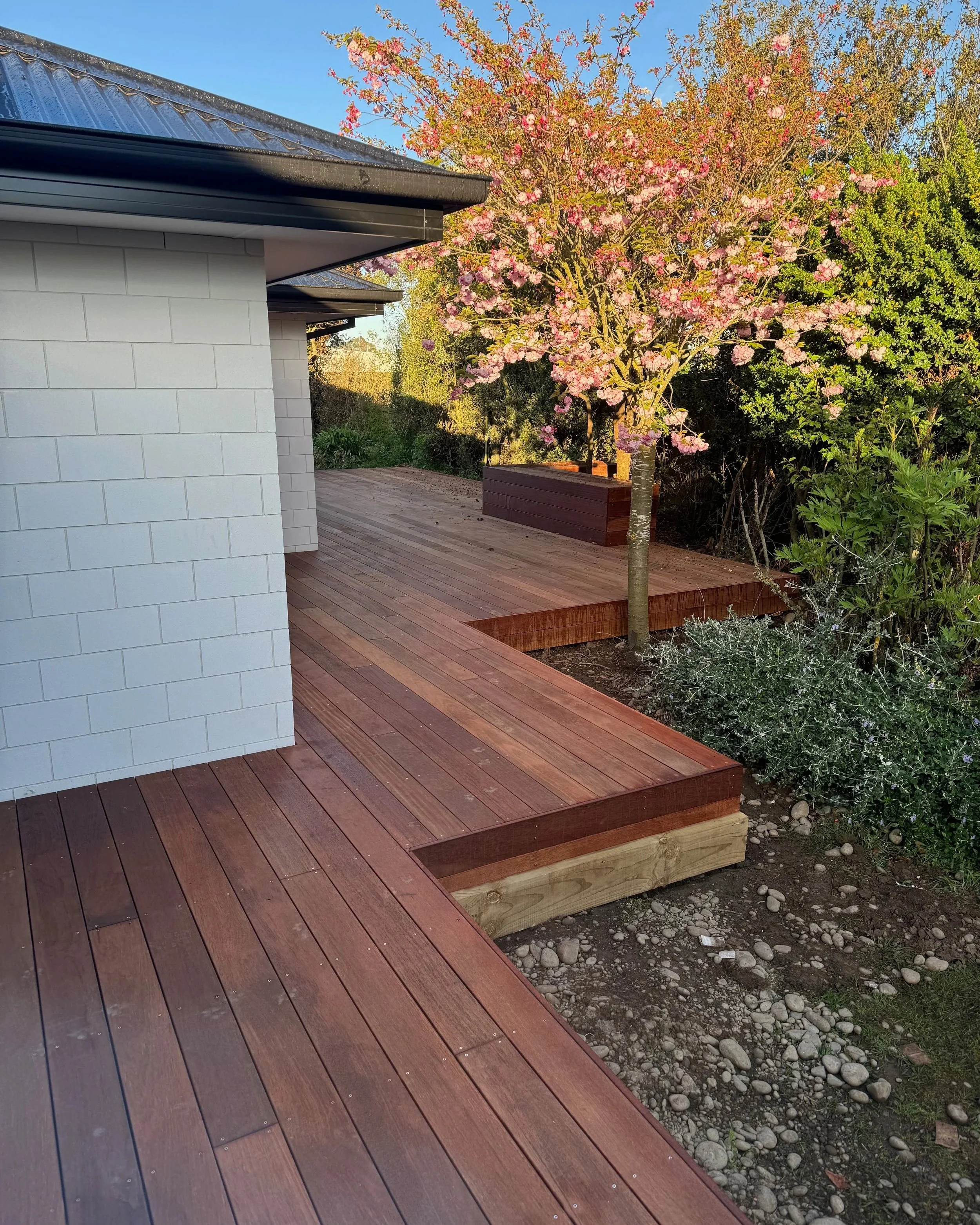 Dunshea Construction designed and built this extended wrap around deck with built in seating for a new home build in Rolleston, Selwyn.