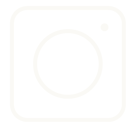 Icon of a washing machine or dryer with a circular door and a small control button in the upper right corner.
