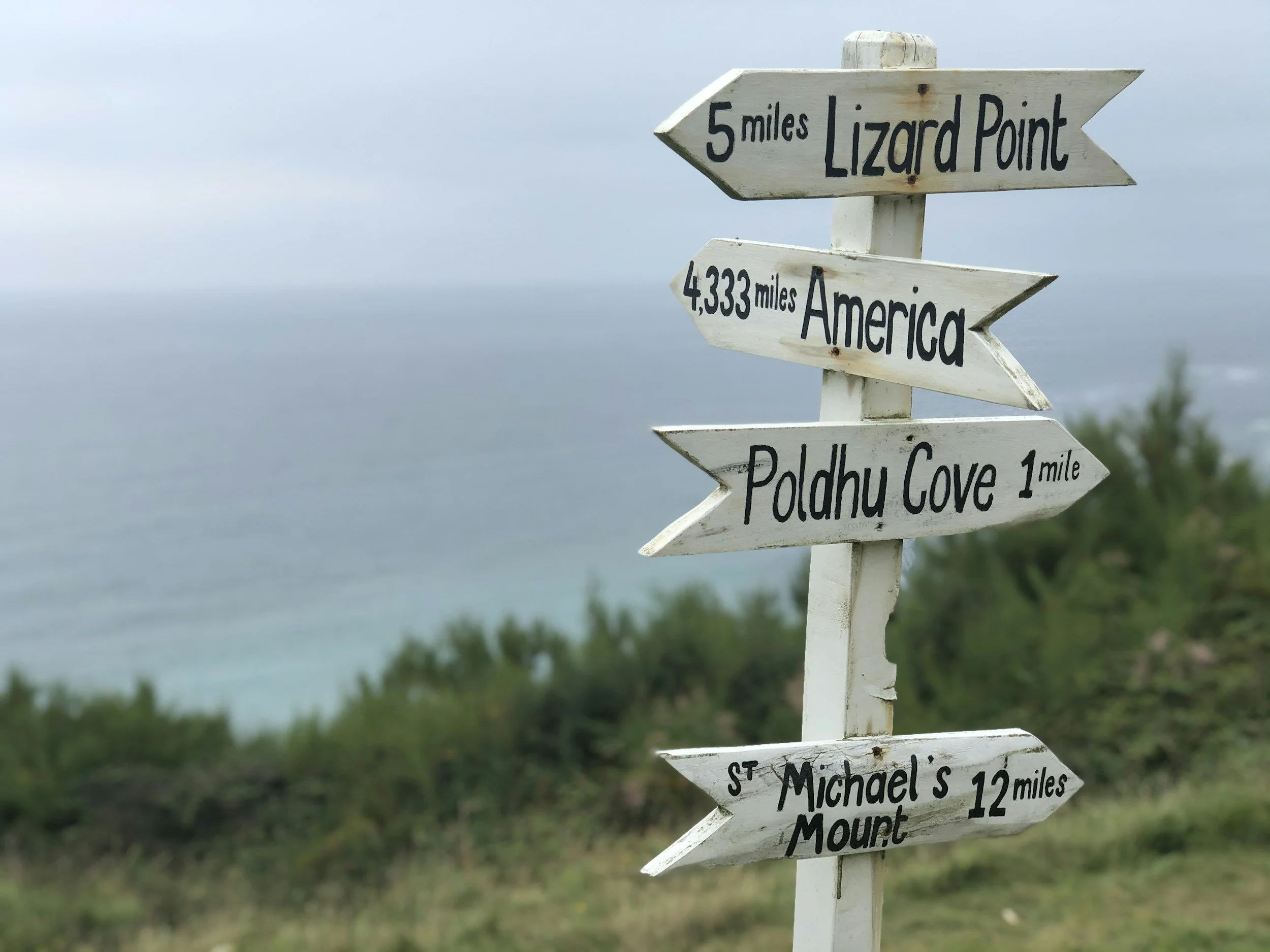 signpost showing destinations in Cornwall including St Michaels mount and lizard point
