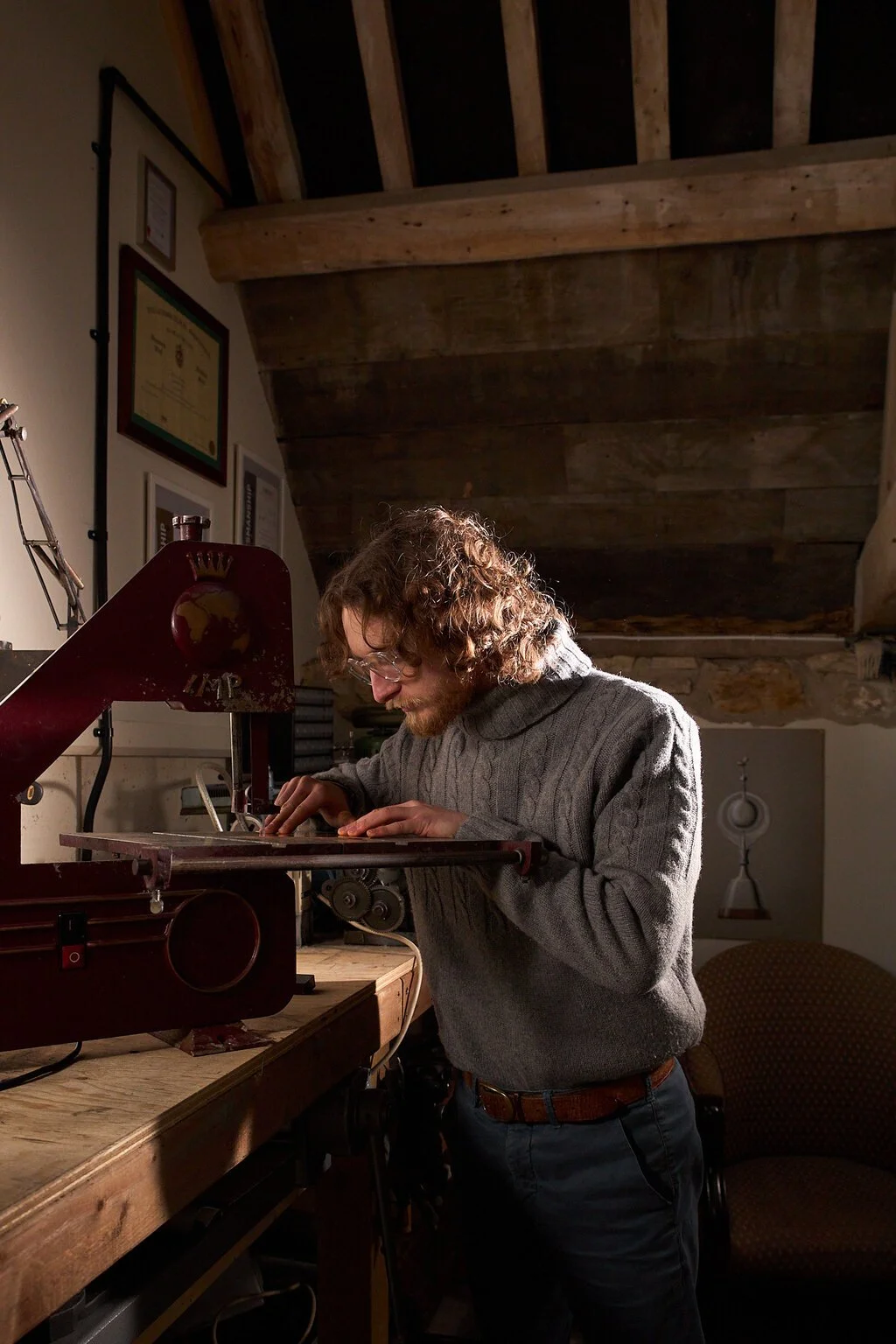 A photographic portrait of silversmith Harry Stokes in his workshop on the edge of Cotswolds.