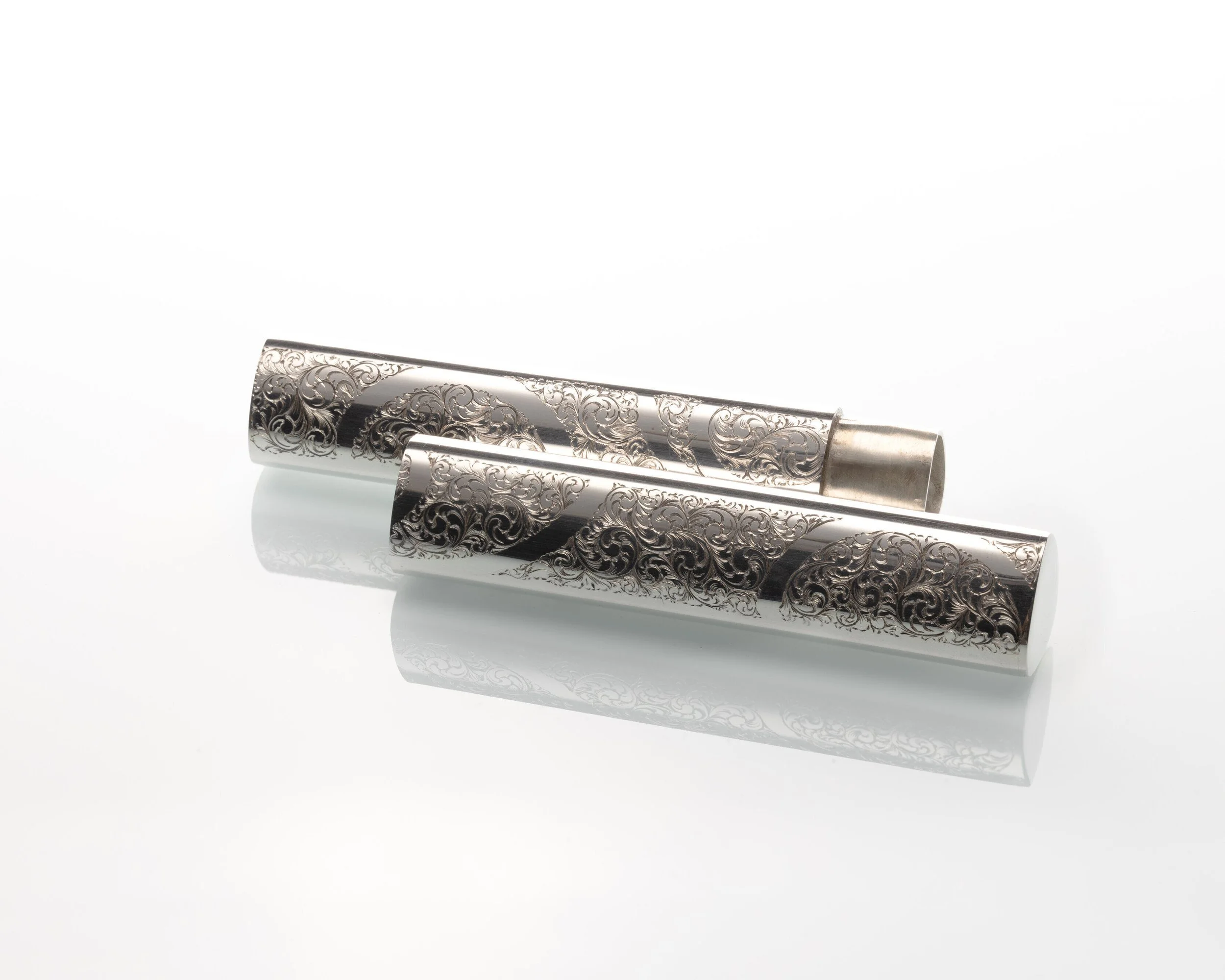 Image of sterling silver case with engraved filigree design by Harry Stokes the silversmith.