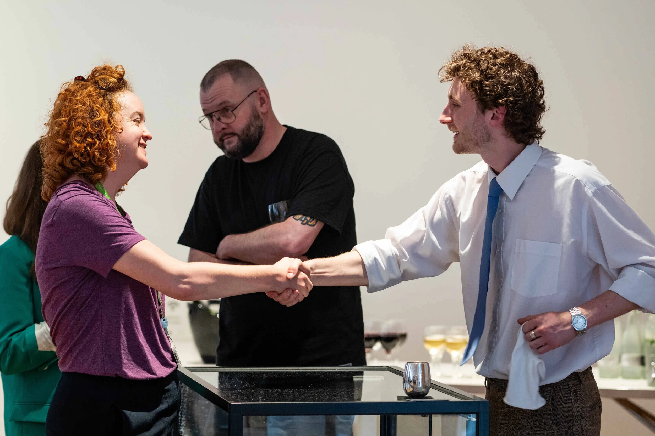 Harry Stokes shaking hands with fellow silversmith at the Bishopsland Educational Trust.