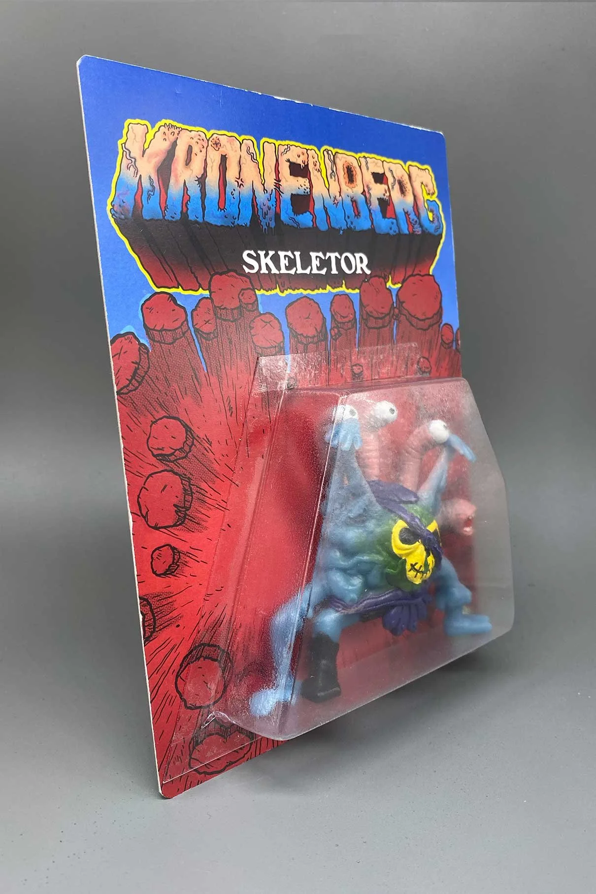 pablo-perra-art-toys-kronenberg-skeletor-cardback-side.jpg