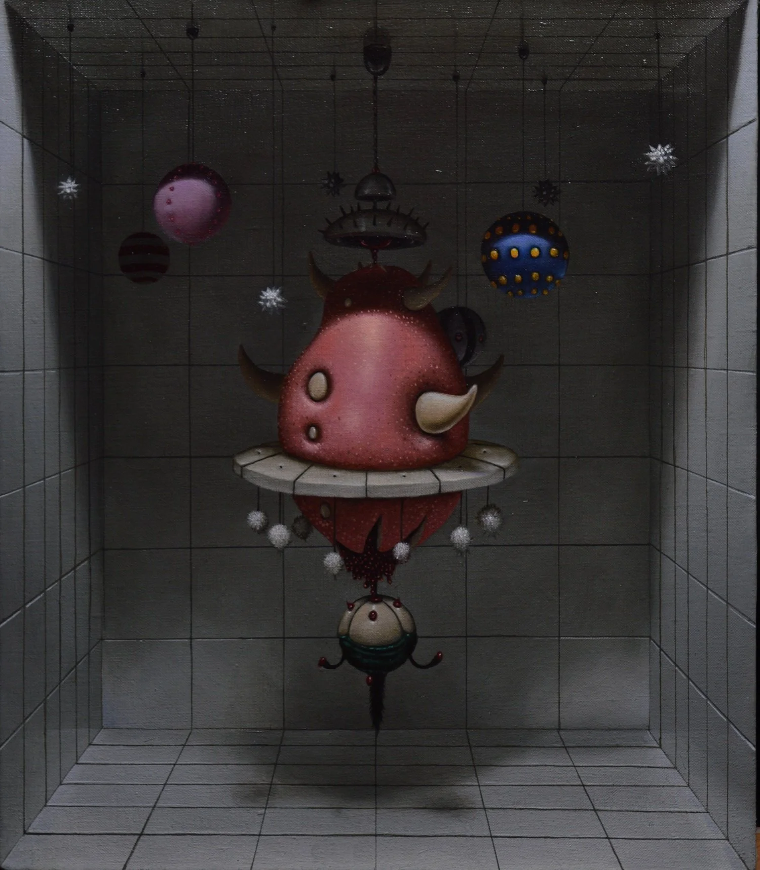 Decorative hanging sculpture in a tiled room featuring a red horned creature with a pointed nose, surrounded by colorful spherical ornaments and white snowflake decorations.