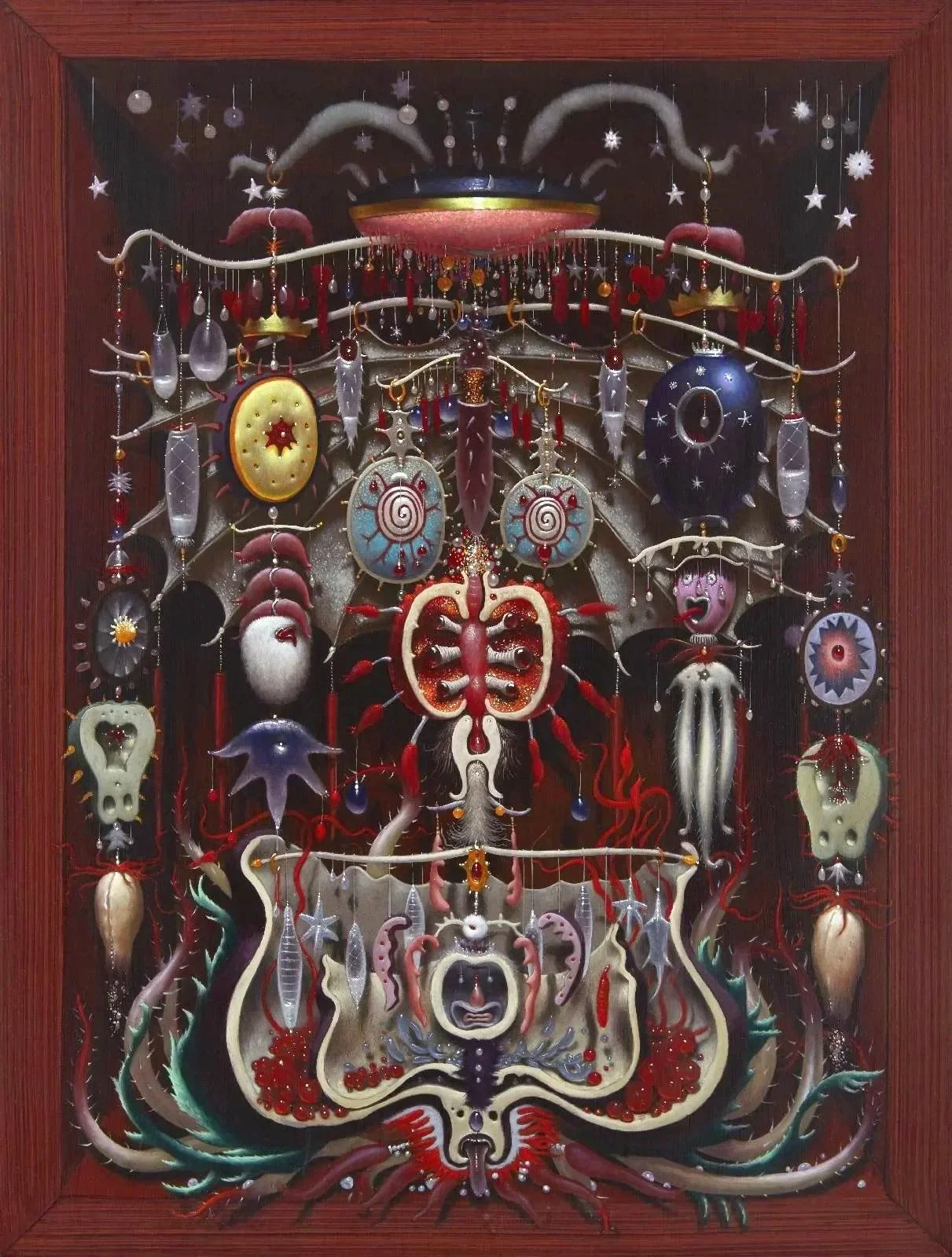 A collection of abstract, surreal, and psychedelic hanging ornaments and sculptures with various shapes, colors, and textures, arranged against a dark background within a wooden frame.