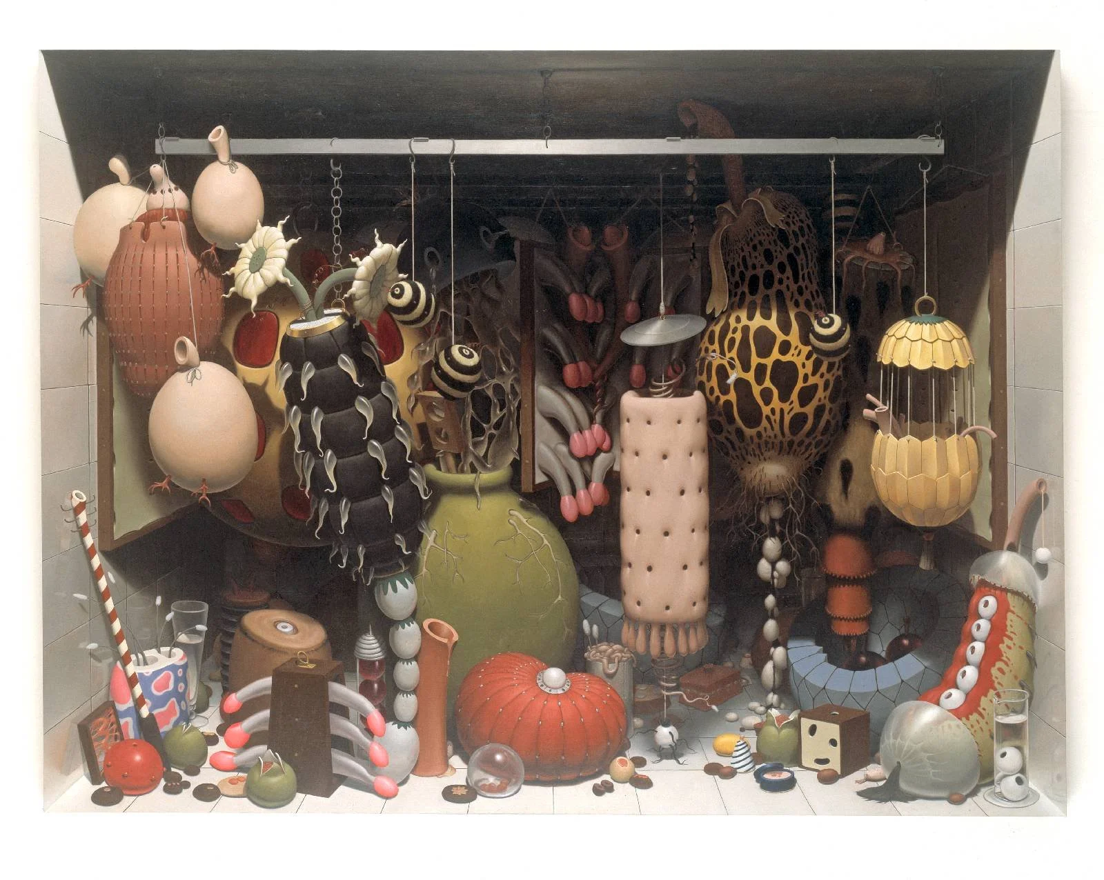 A display of various unconventional and artistic objects resembling abstract creatures, faces, and shapes made from mixed materials, arranged on a shelf with a dark background.