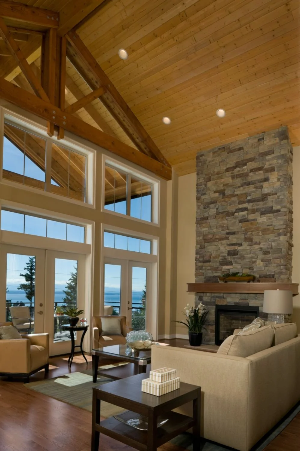 Living room with a wall of windows and a fireplace