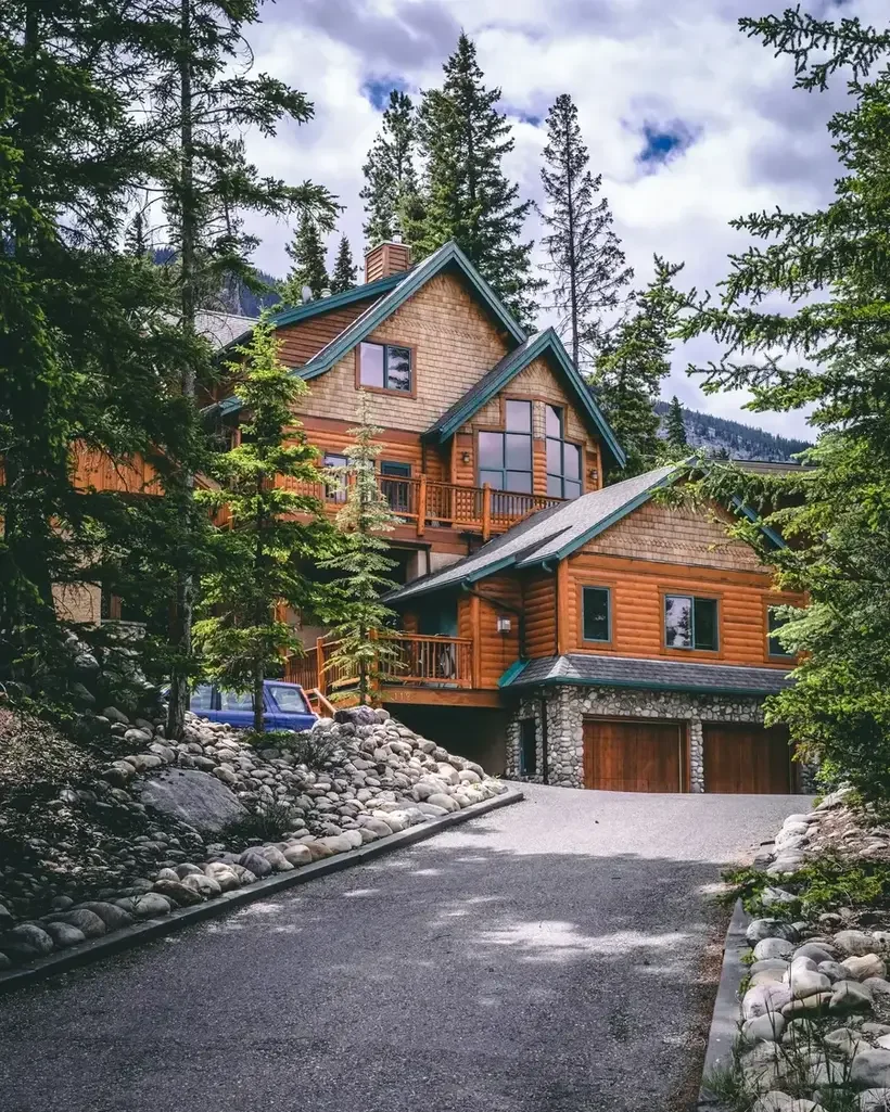 Driveway and view of large home in the mountains